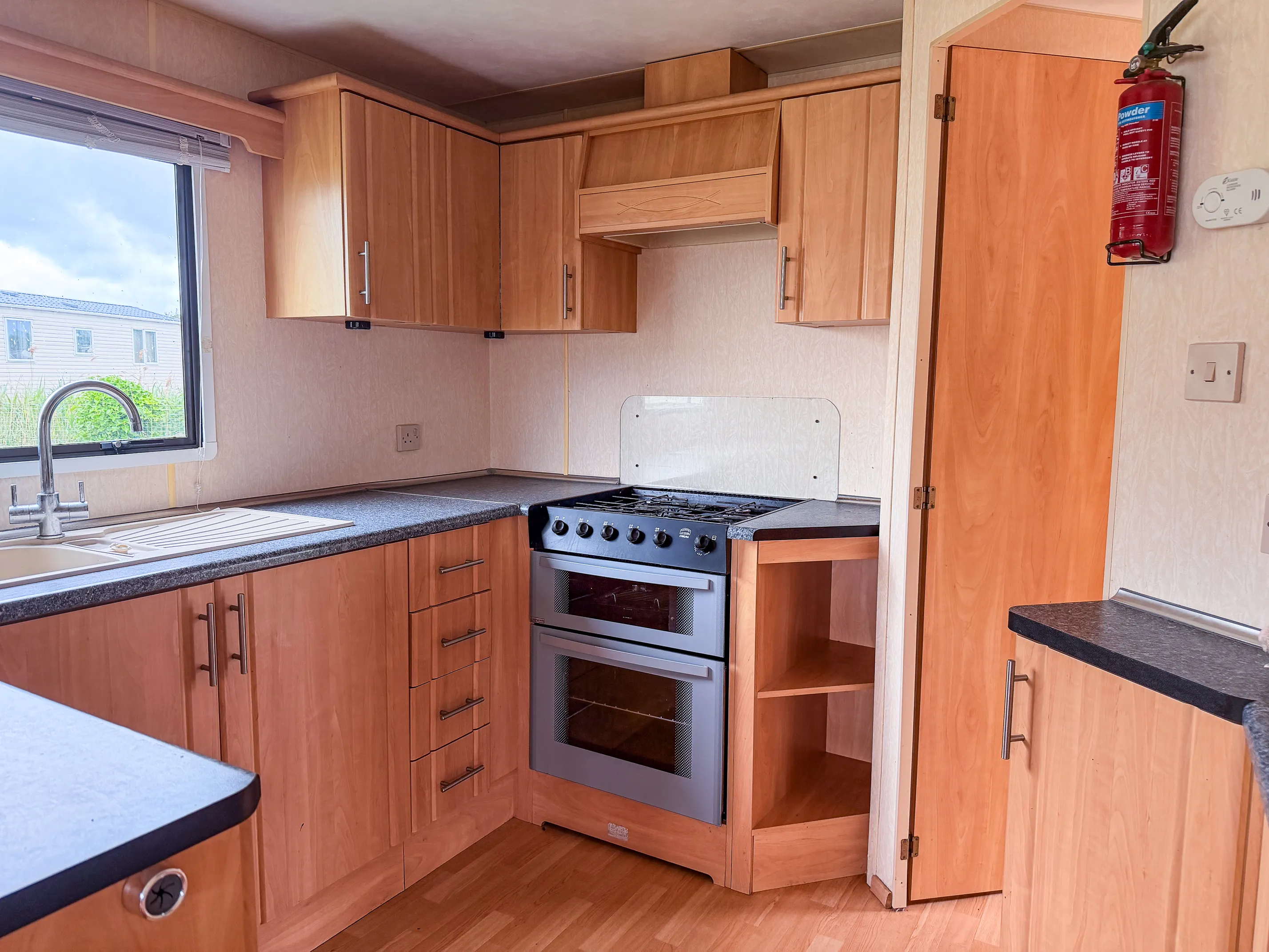 ABI Colorado located in Skegness view of an interior kitchen with a view of the double oven and cooker