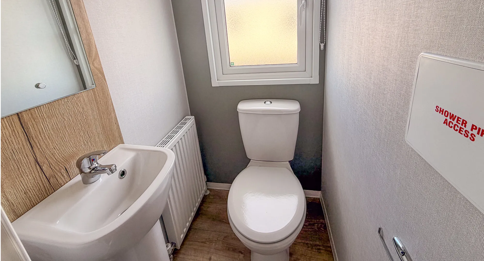 second bathroom with a toilet and sink
