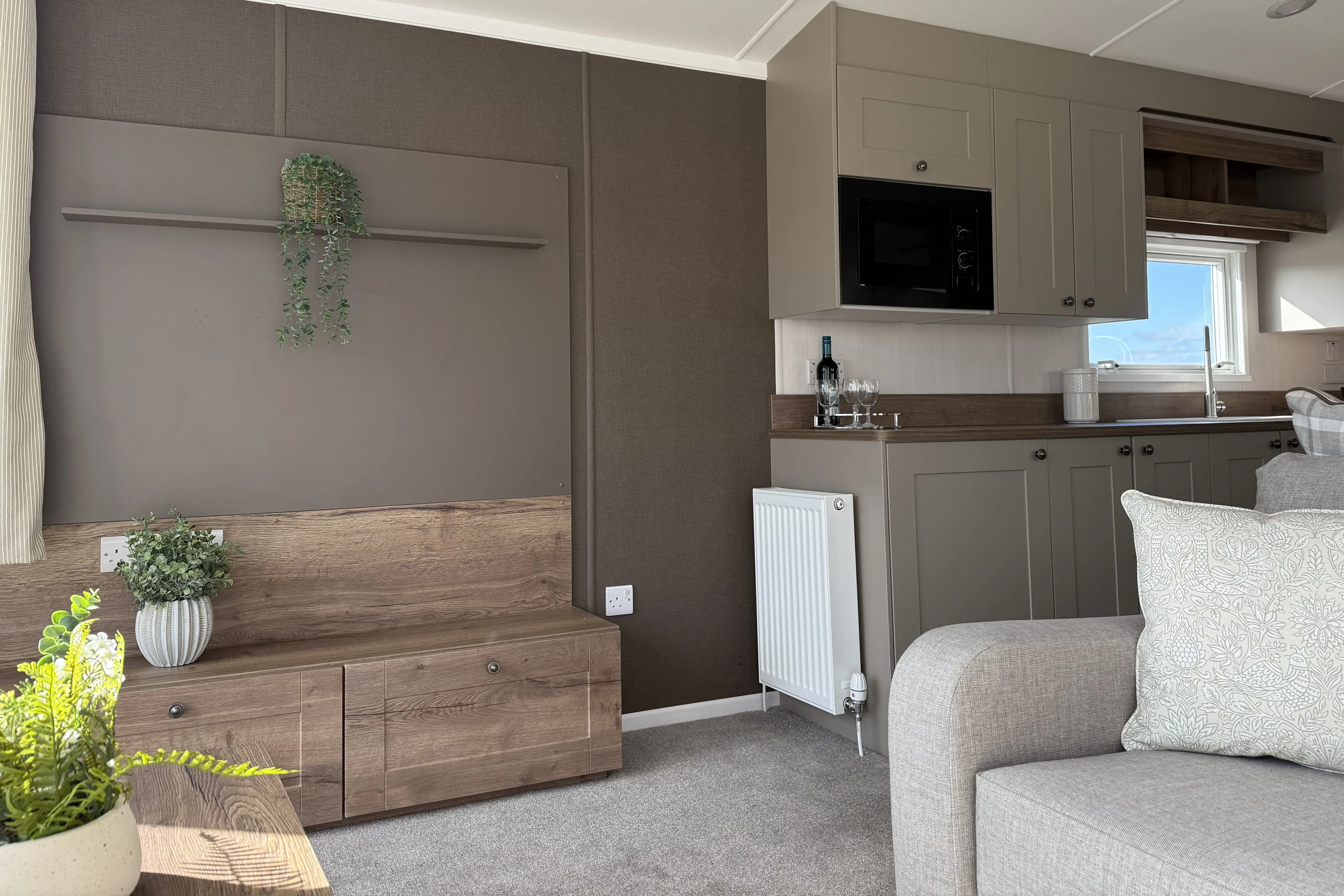 Modern farmhouse-inspired lounge featuring stylish furnishings in the 2026 Swift Sienna holiday home.