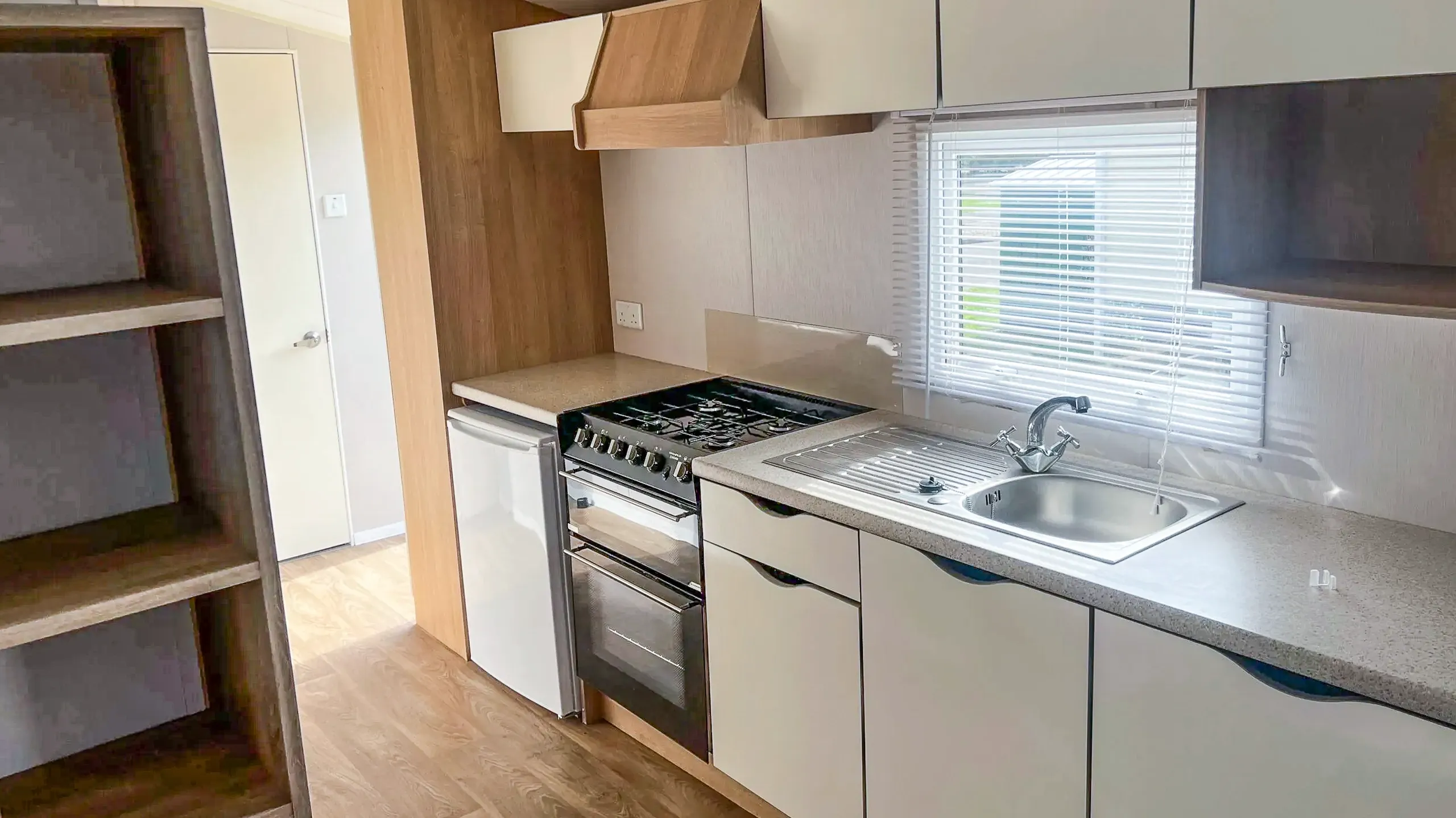 Kitchen units and cooker in a 2015 Willerby Vacation caravan for sale at Coastfields Leisure
