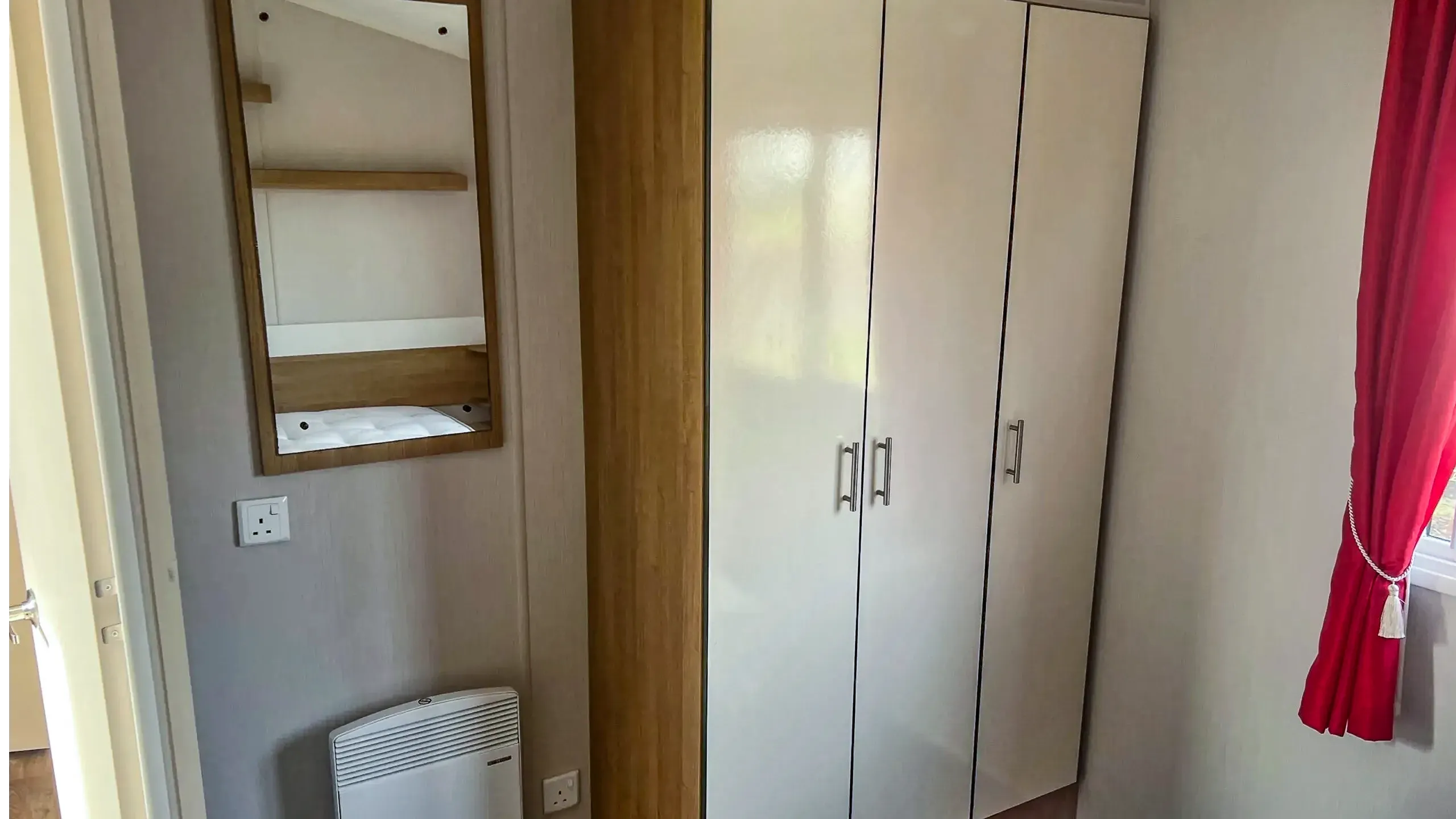 Master bedroom wardrobe storage in a 2015 Willerby Vacation caravan at Roach Farm in Skegness