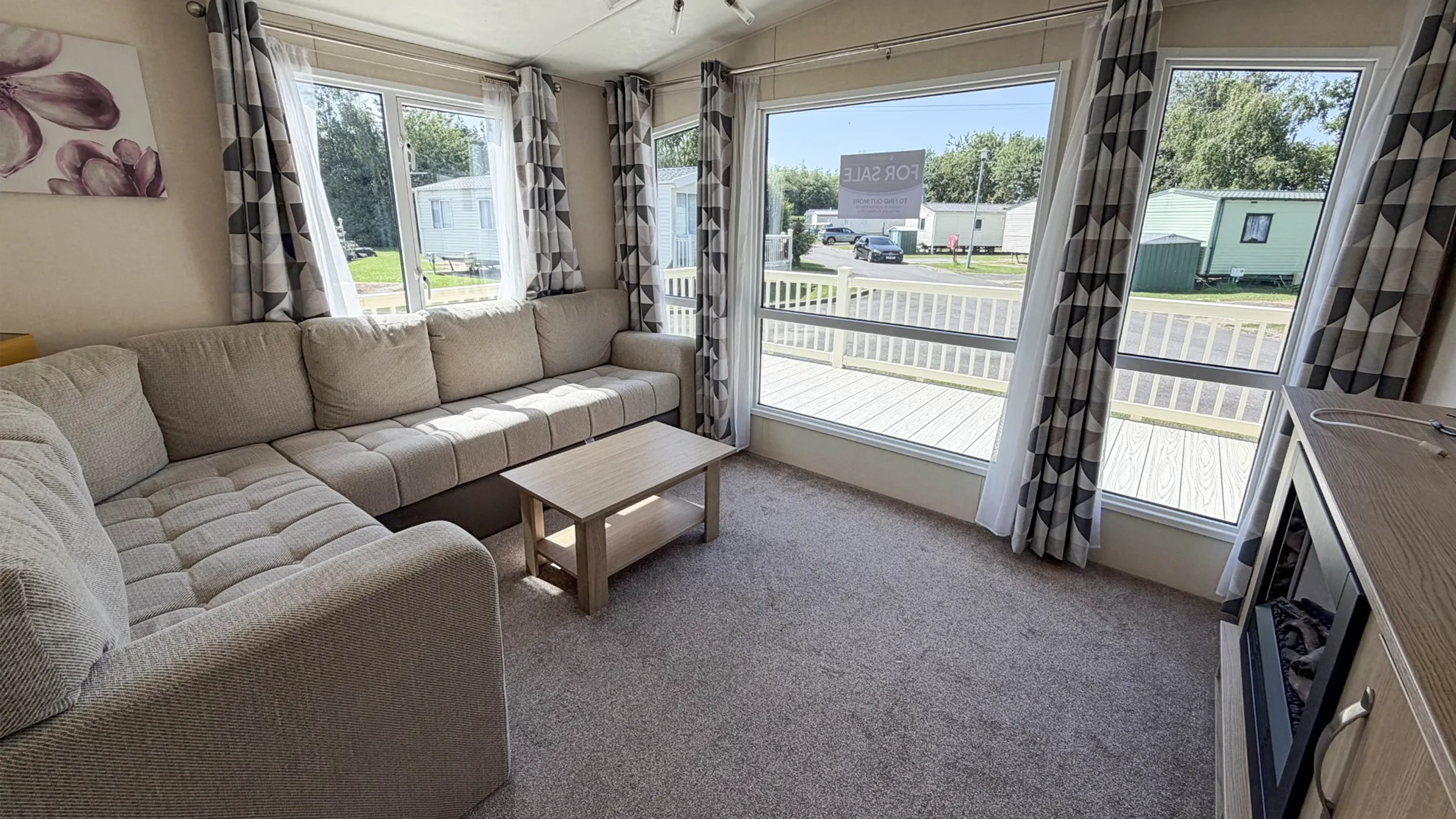 interior living room with l-shaped sofa and large window