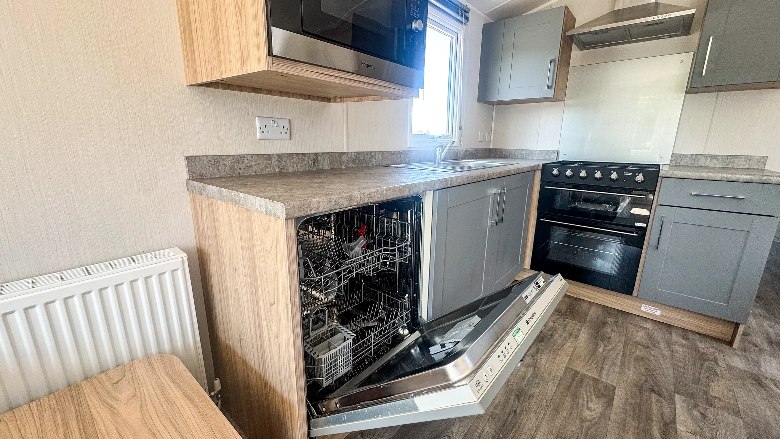 Kitchen with open built in dishwasher