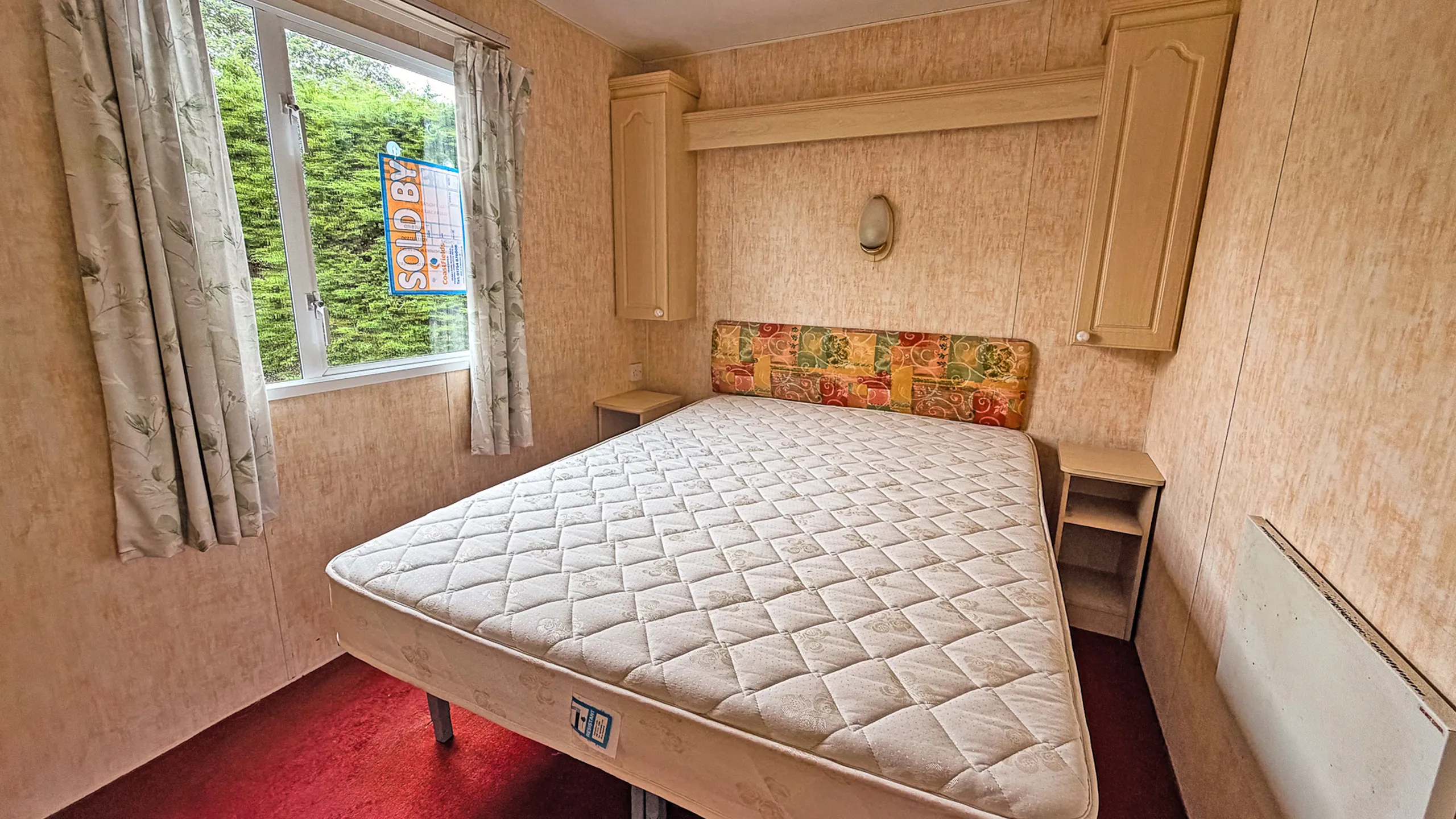 double bedroom inside a holiday home caravan 