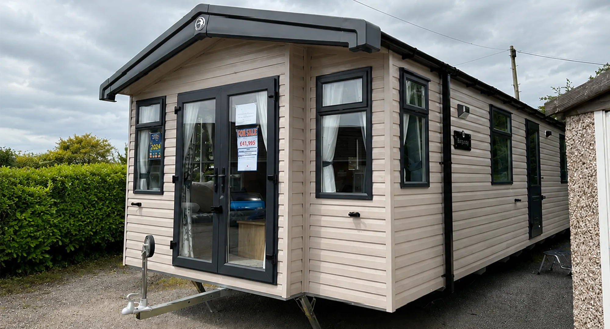 2023 Swift Burgundy 2 bed external view with front french doors and side windows