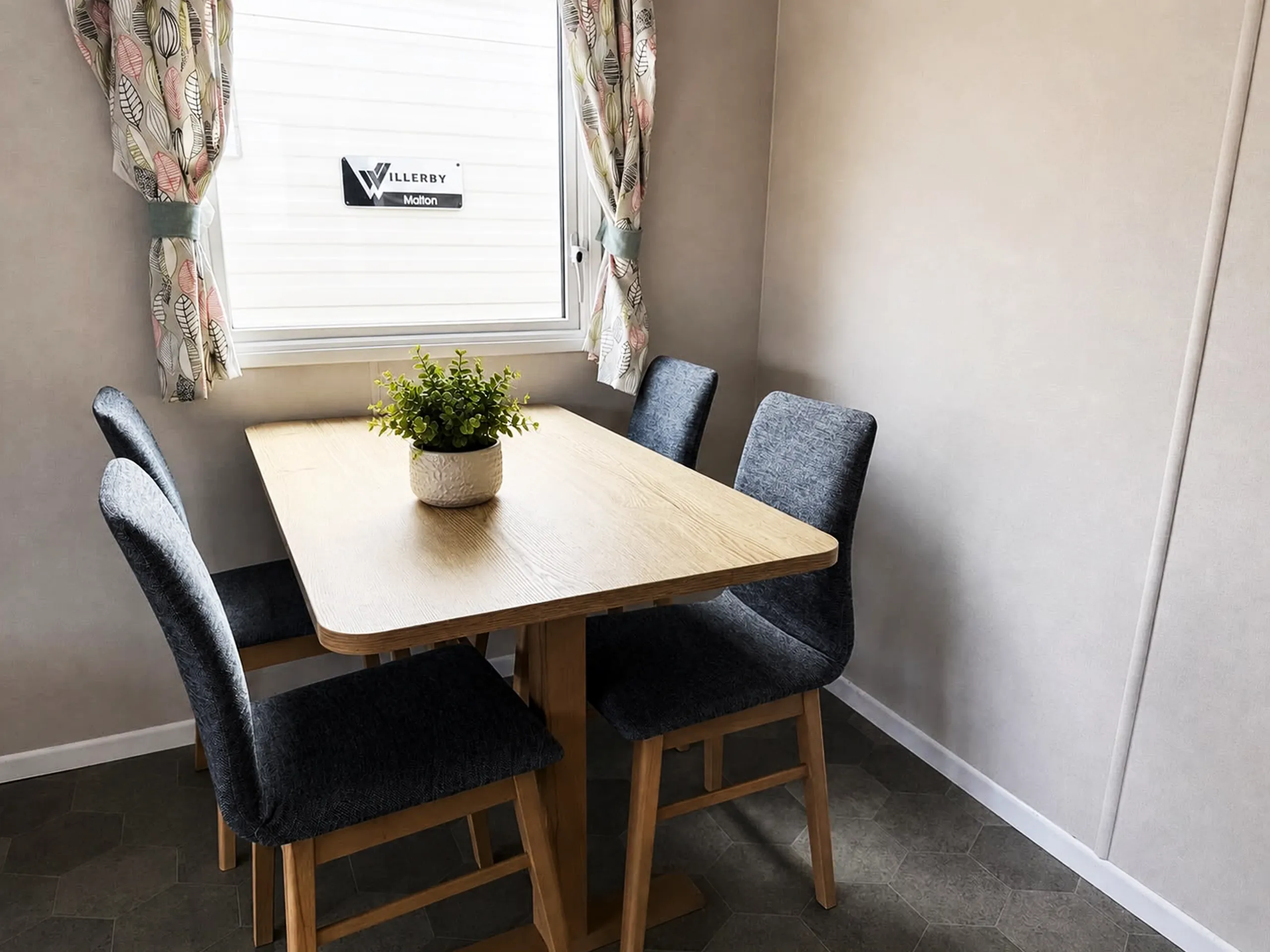 free standing dining table and chairs inside the 2022 ABI Adelaide holiday home