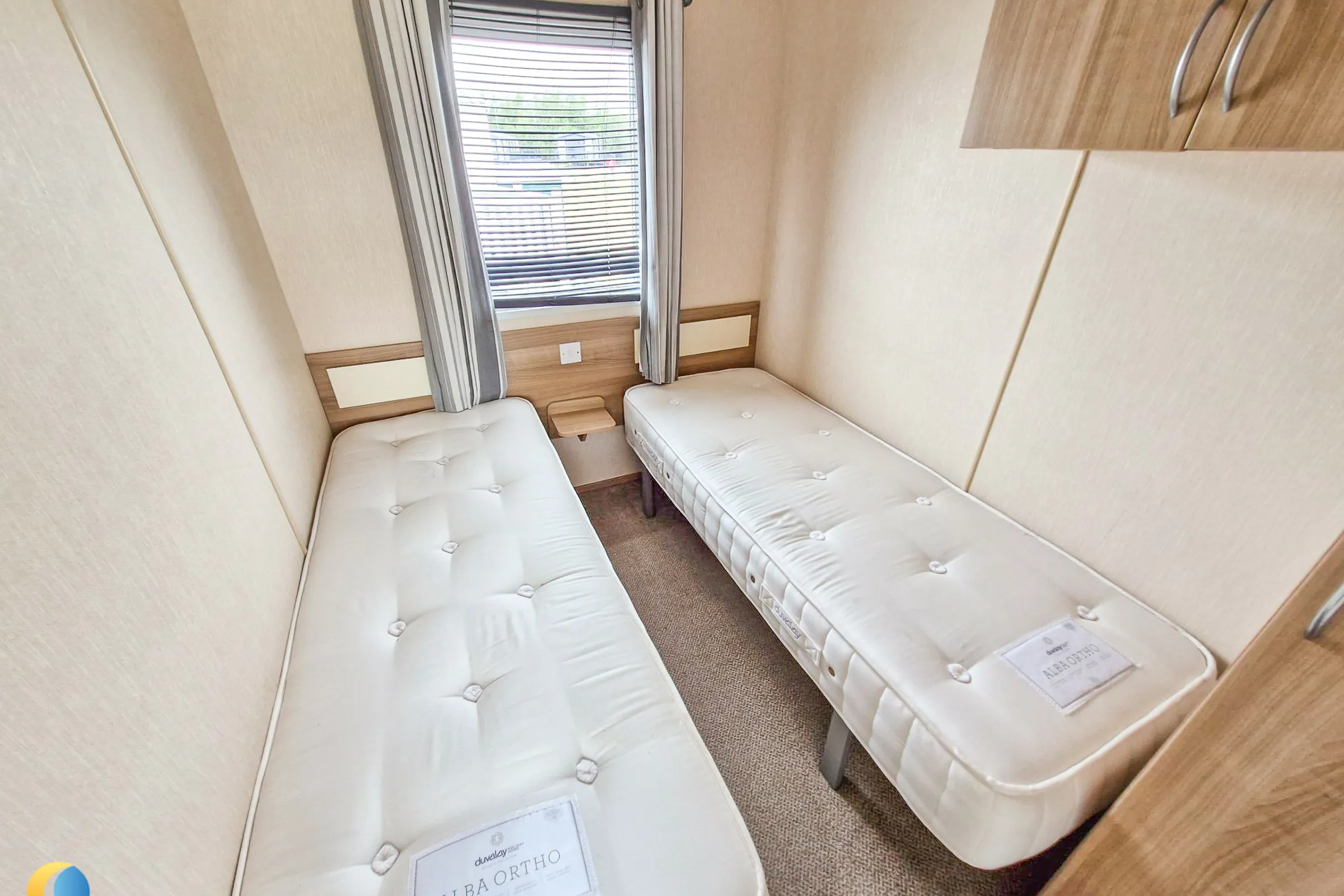 Coastfields 2012 ABI Tebay twin bedroom with fitted storage