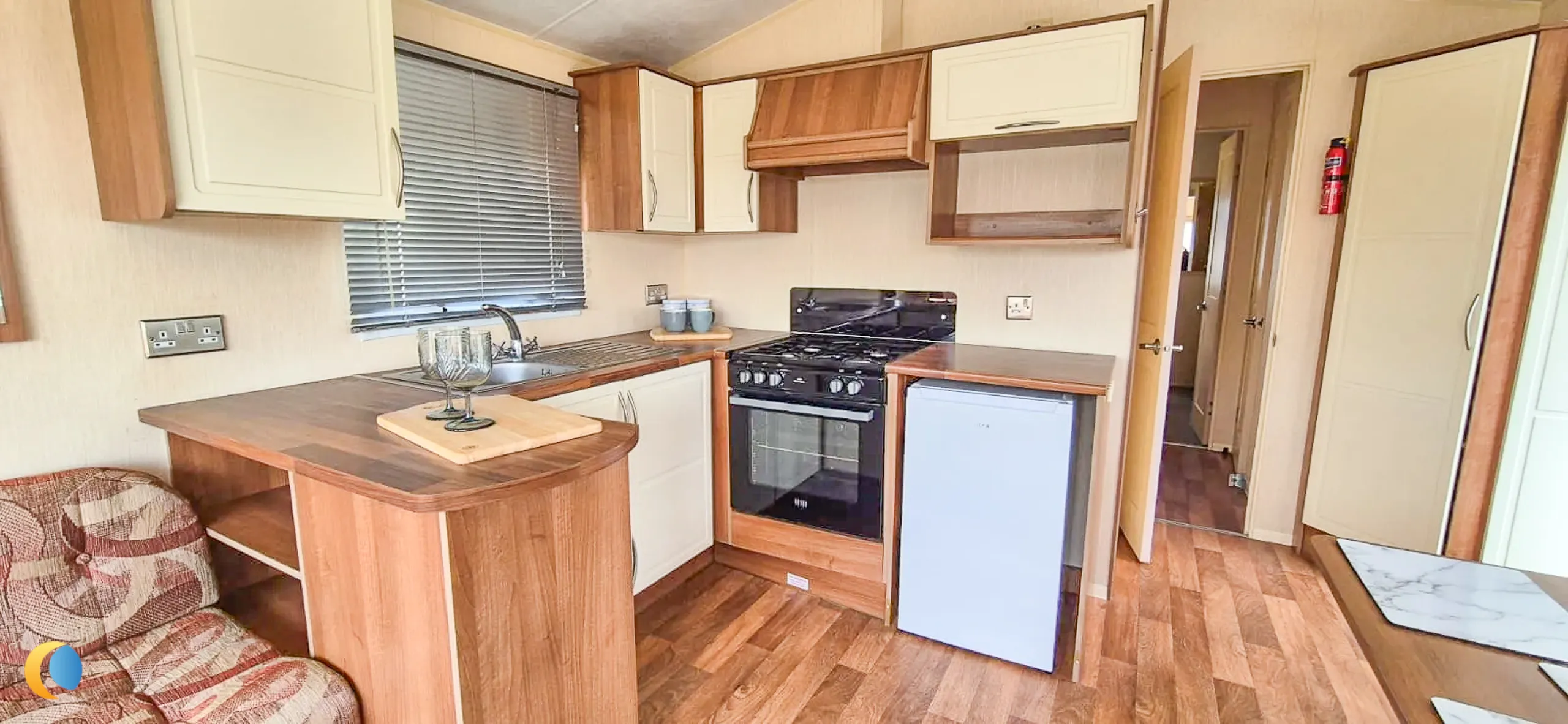 Coastfields 2012 Willerby Rio Gold fitted kitchen with worktop and storage space