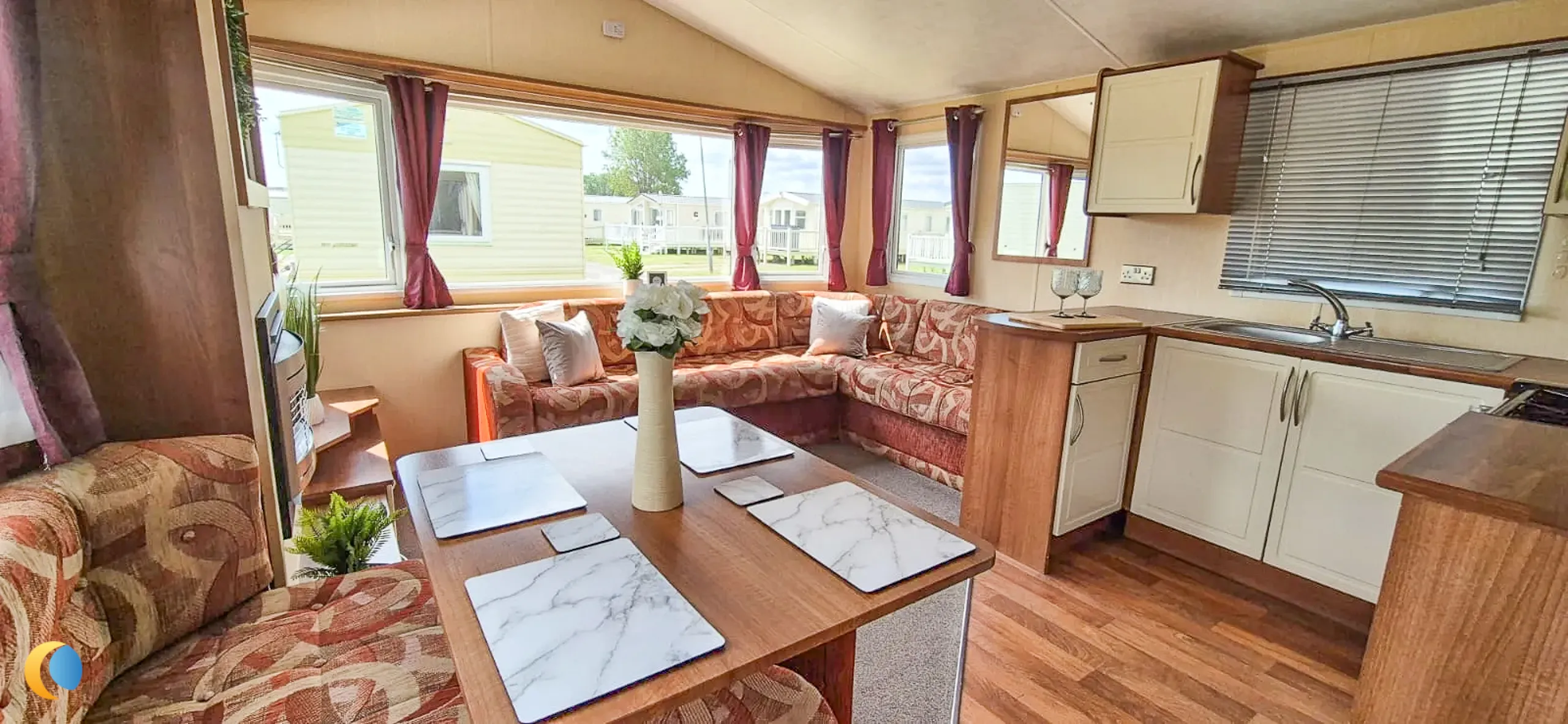 Coastfields 2012 Willerby Rio Gold open-plan living and dining area with red interior finish