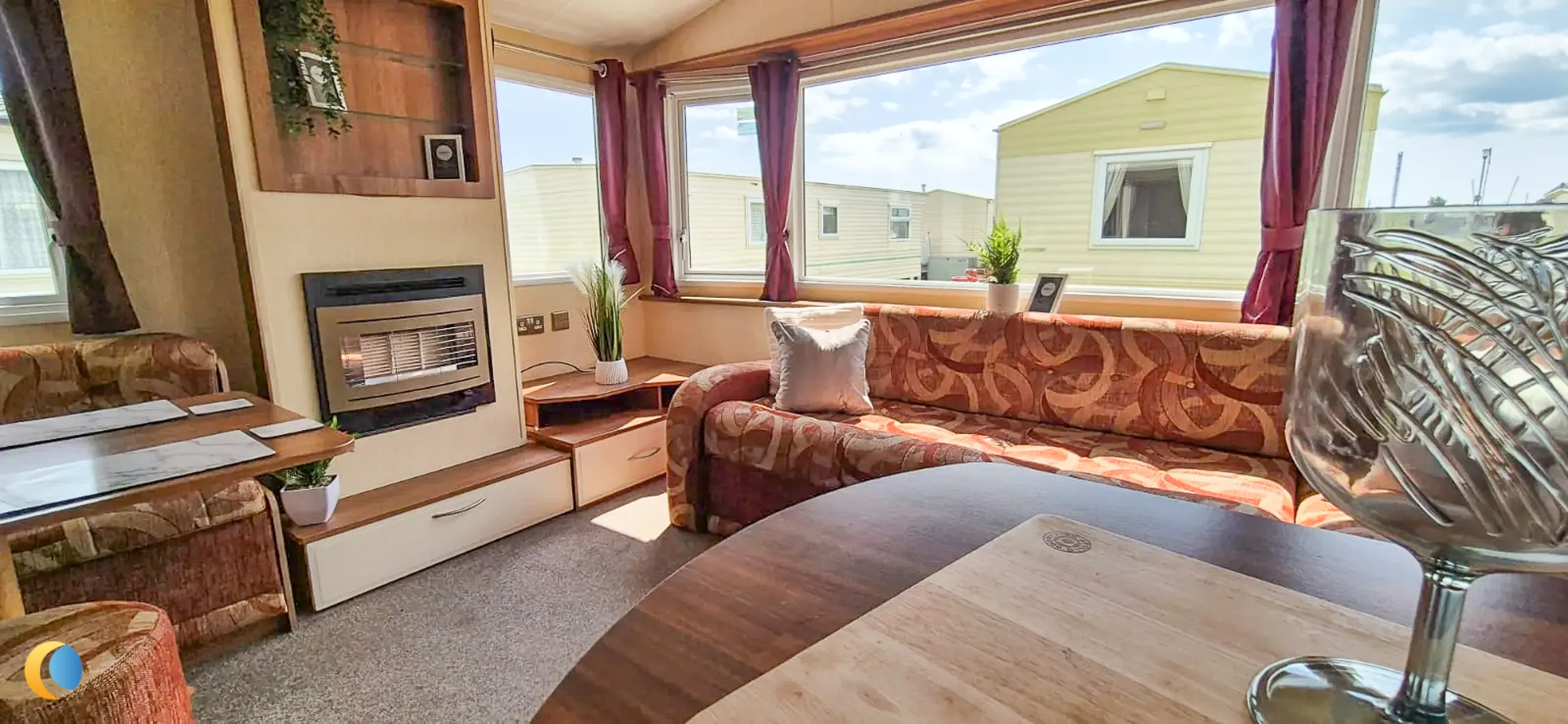 Coastfields 2012 Willerby Rio Gold lounge with wraparound seating and fireplace