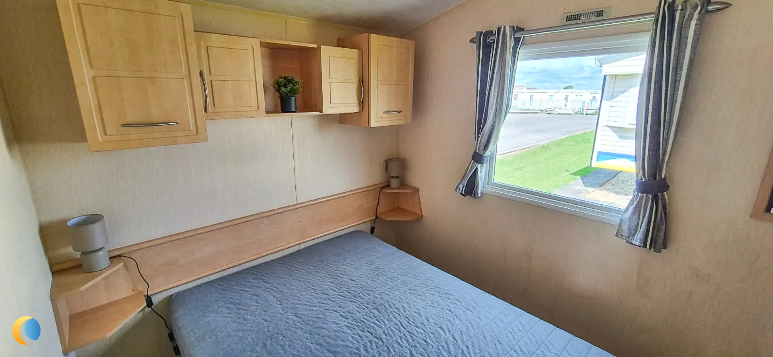 Coastfields 2012 Willerby Rio Gold master bedroom with built-in storage