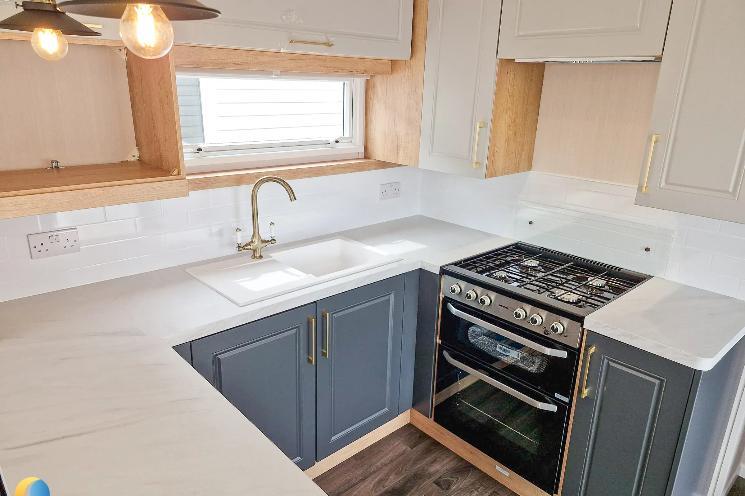 Coastfields 2026 Swift Bordeaux U-shaped fitted kitchen with integrated appliances
