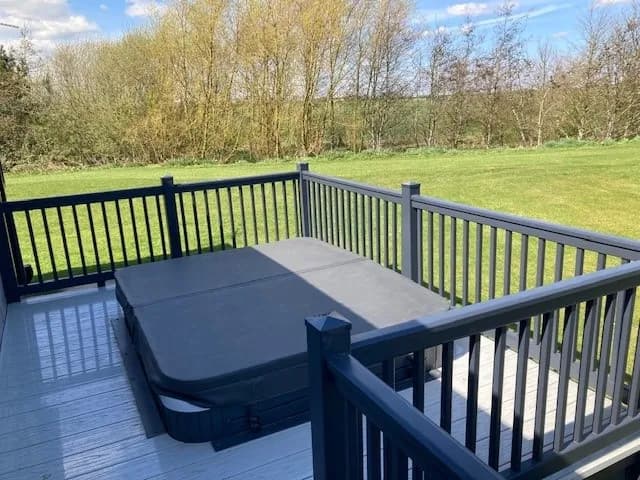 Private hot tub on the decking of the 2023 Willerby Portland Lodge