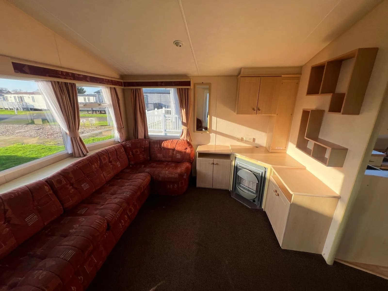 Willerby Richmond caravan interior living room with seating and fireplace