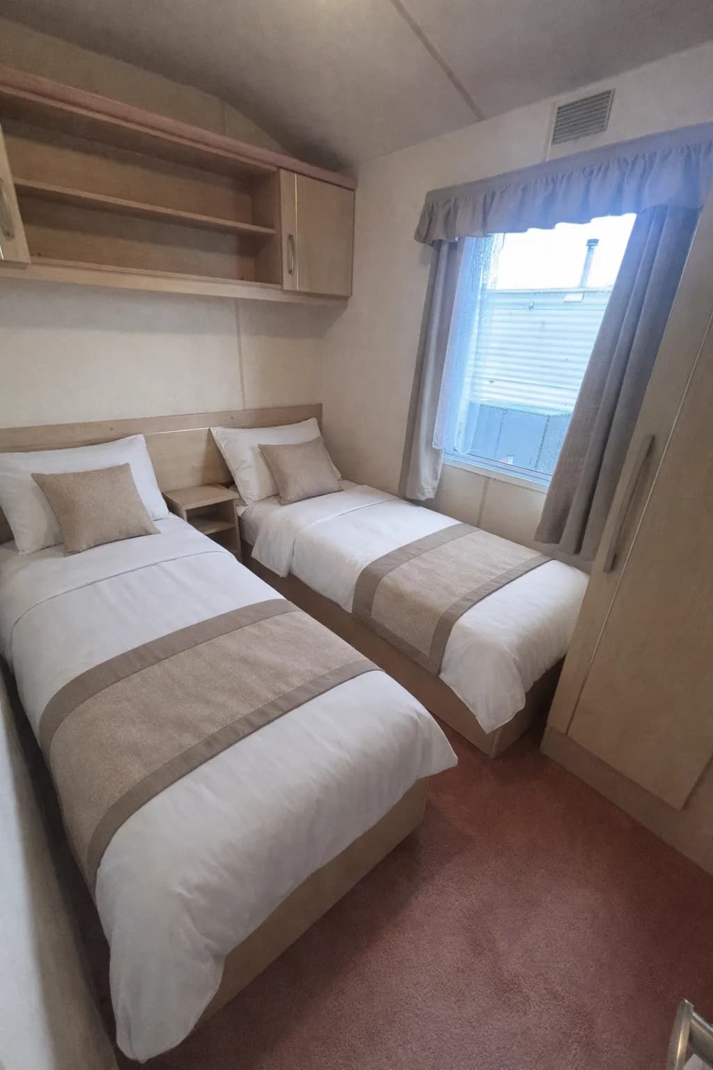 Twin bedroom inside the 2007 Atlas Nevada Plus holiday caravan