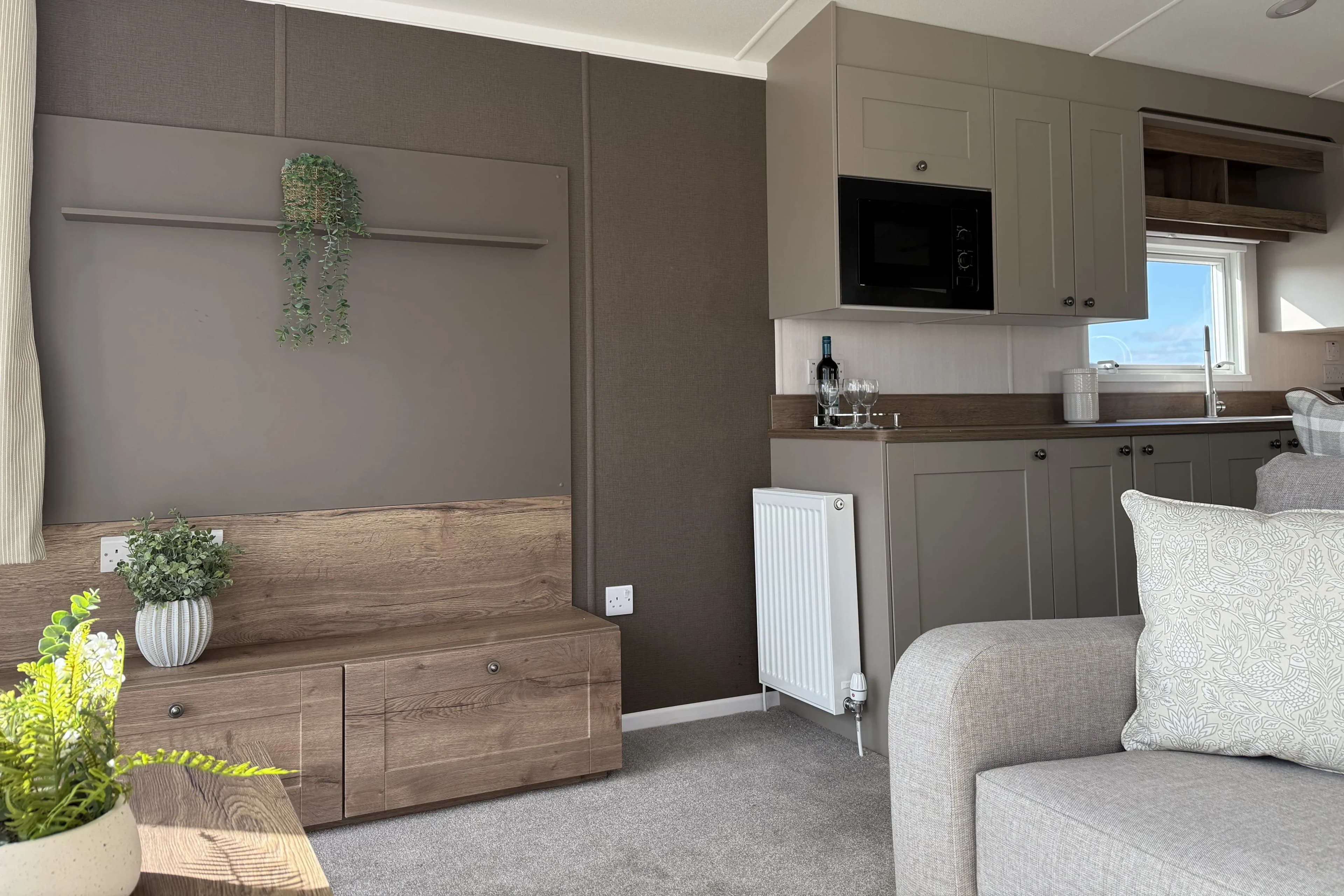 Modern farmhouse-inspired lounge featuring stylish furnishings in the 2026 Swift Sienna holiday home.