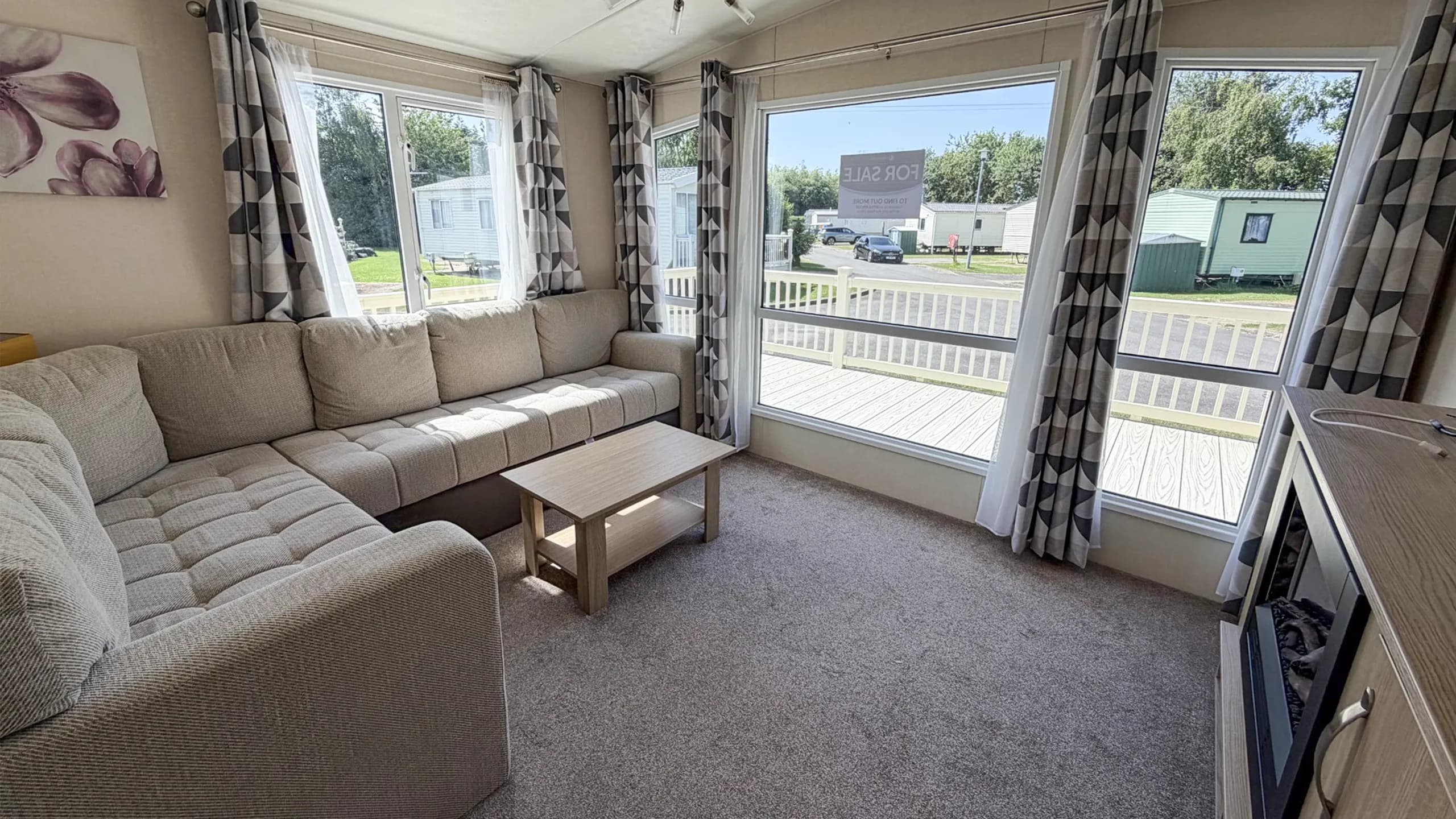 interior living room with l-shaped sofa and large window