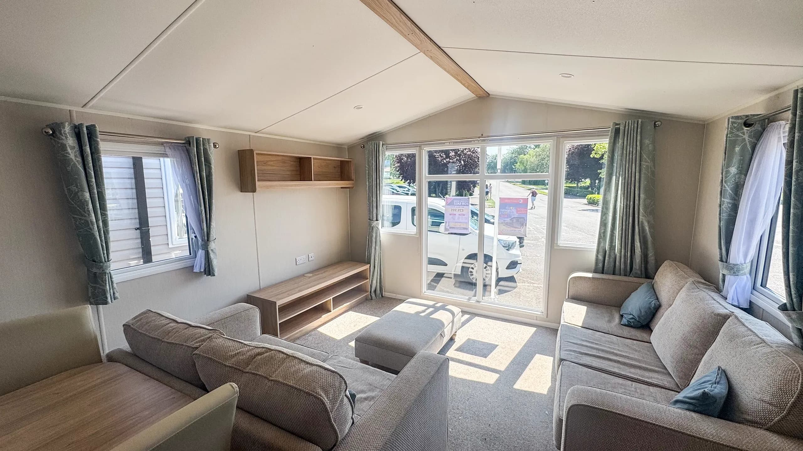 Living room with large patio door on a 2021 Willerby Malton for sale in Skegness