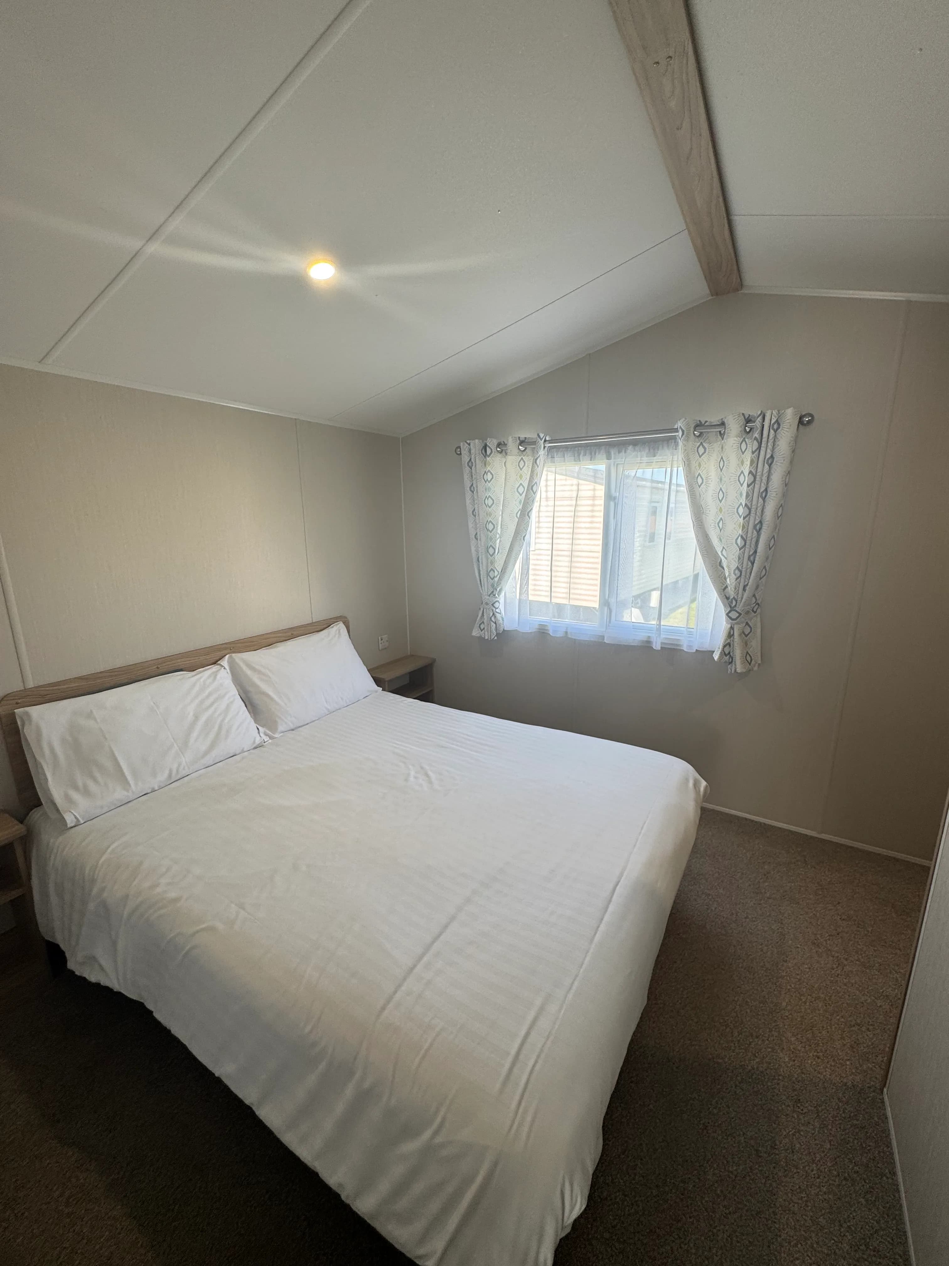 Spacious master bedroom with built-in storage in the 2022 Willerby Malton.