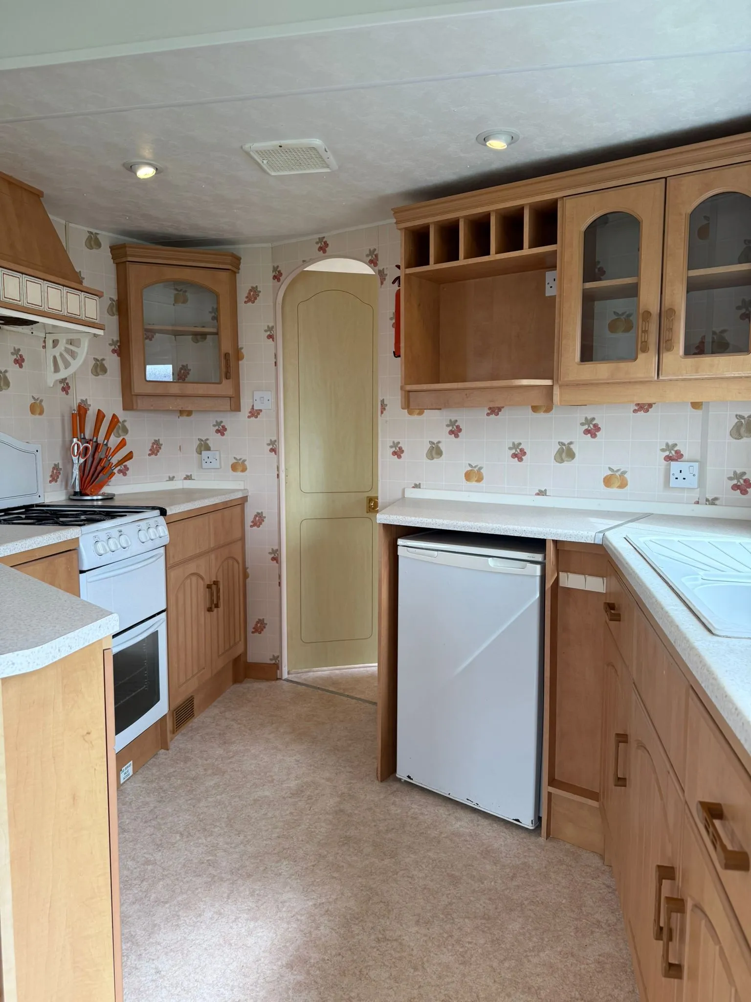 Kitchen in the 2002 Atlas Everglade with practical worktops and storage cupboards