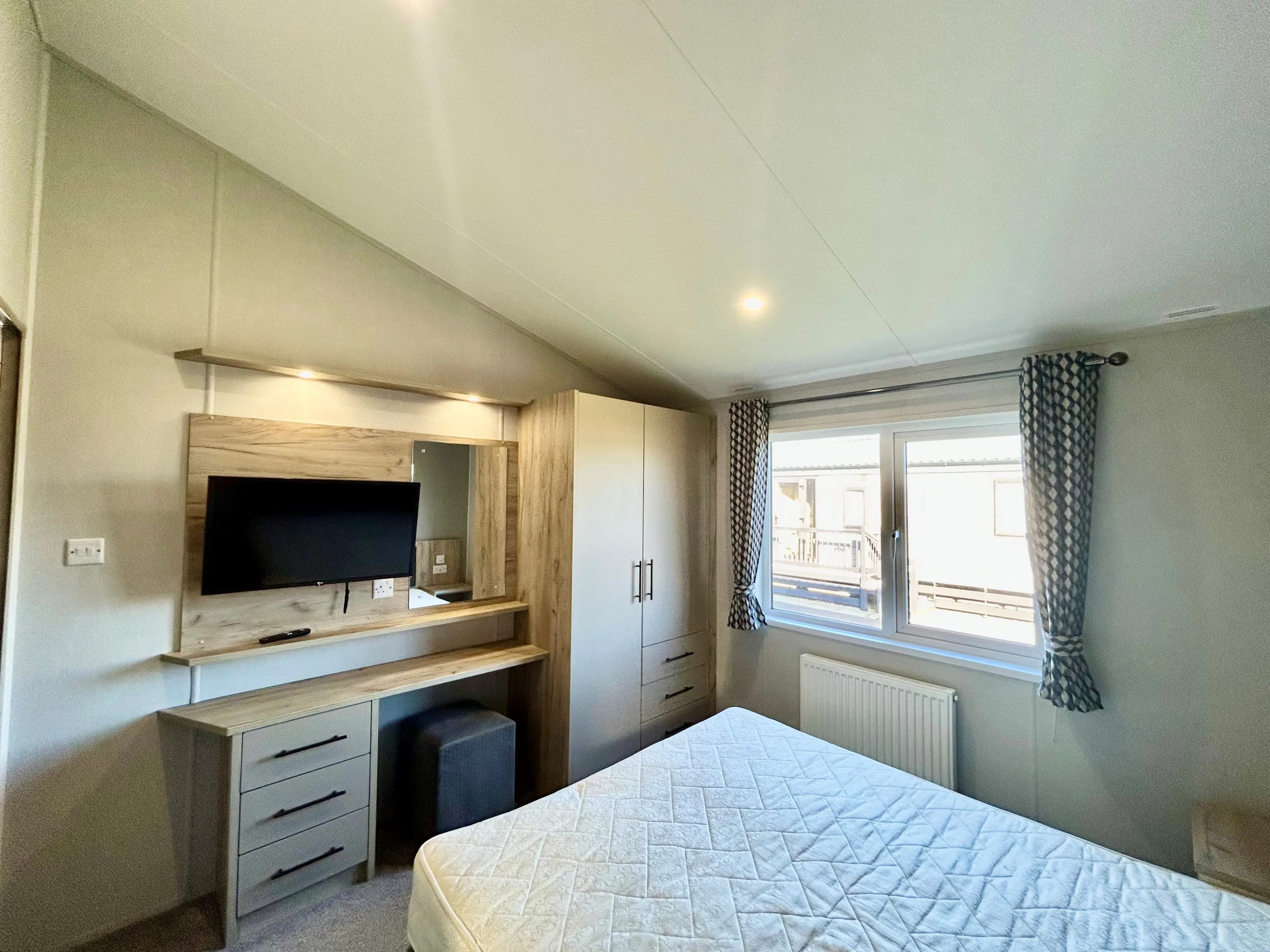 King-size master bedroom with walk-in wardrobe in the 2021 Willerby Mapleton