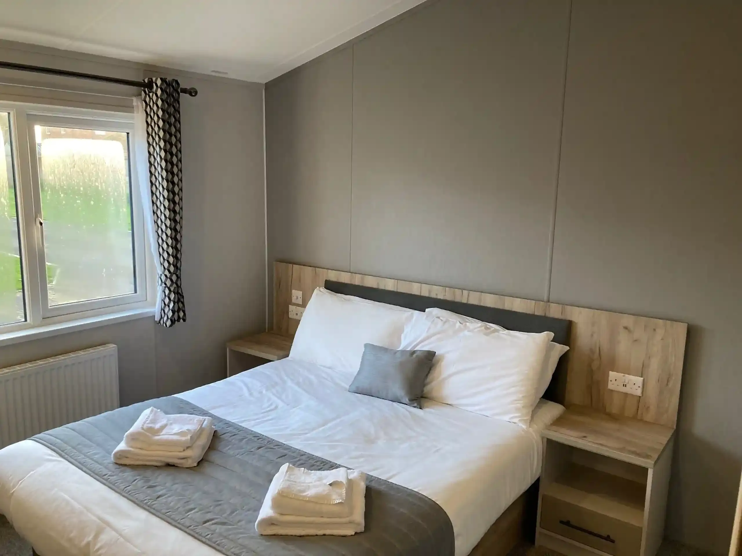 Master bedroom with walk-in wardrobe in the 2023 Willerby Mapleton Lodge
