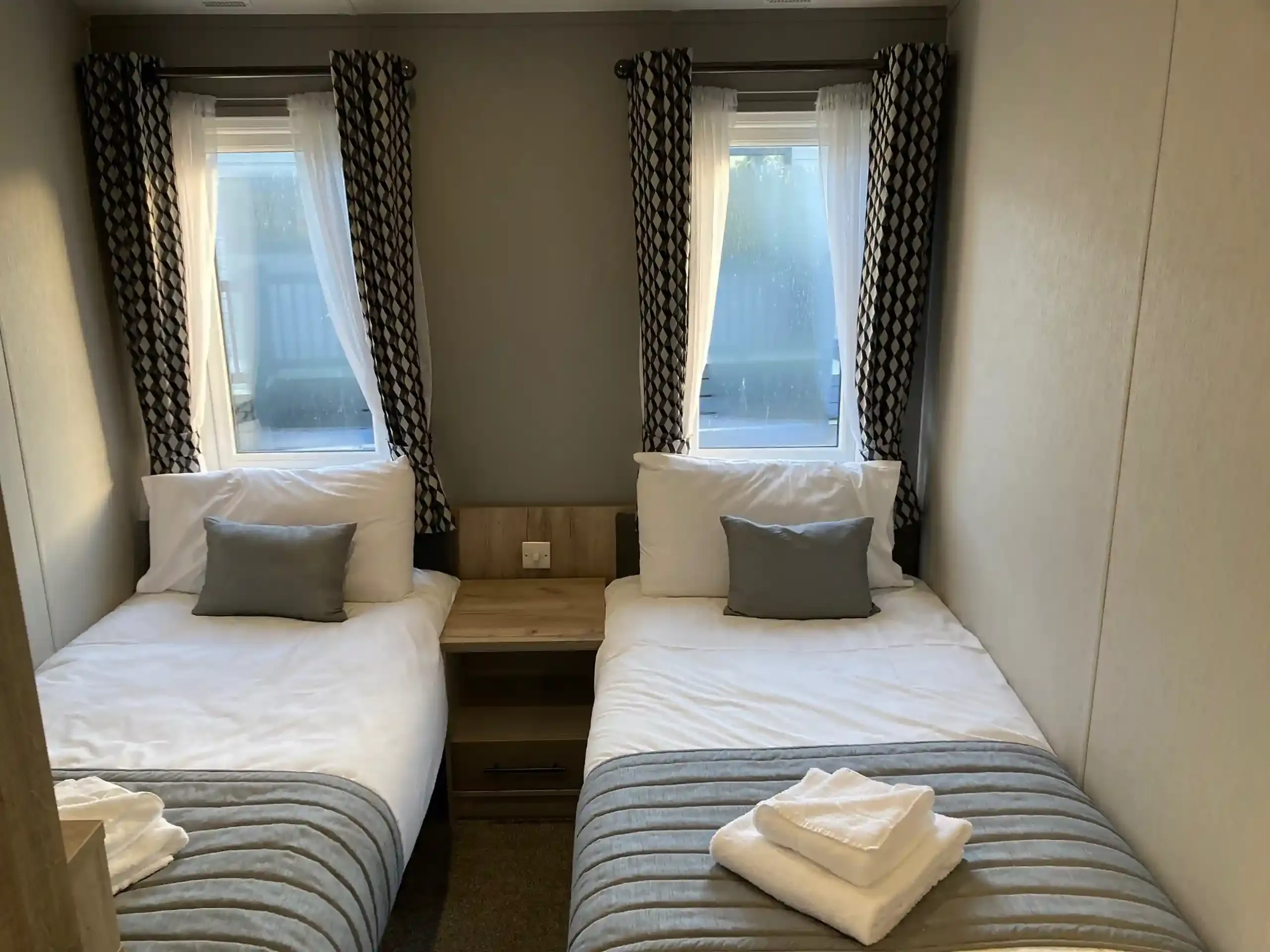 Twin bedroom with full-size single beds in the 2023 Willerby Mapleton Lodge