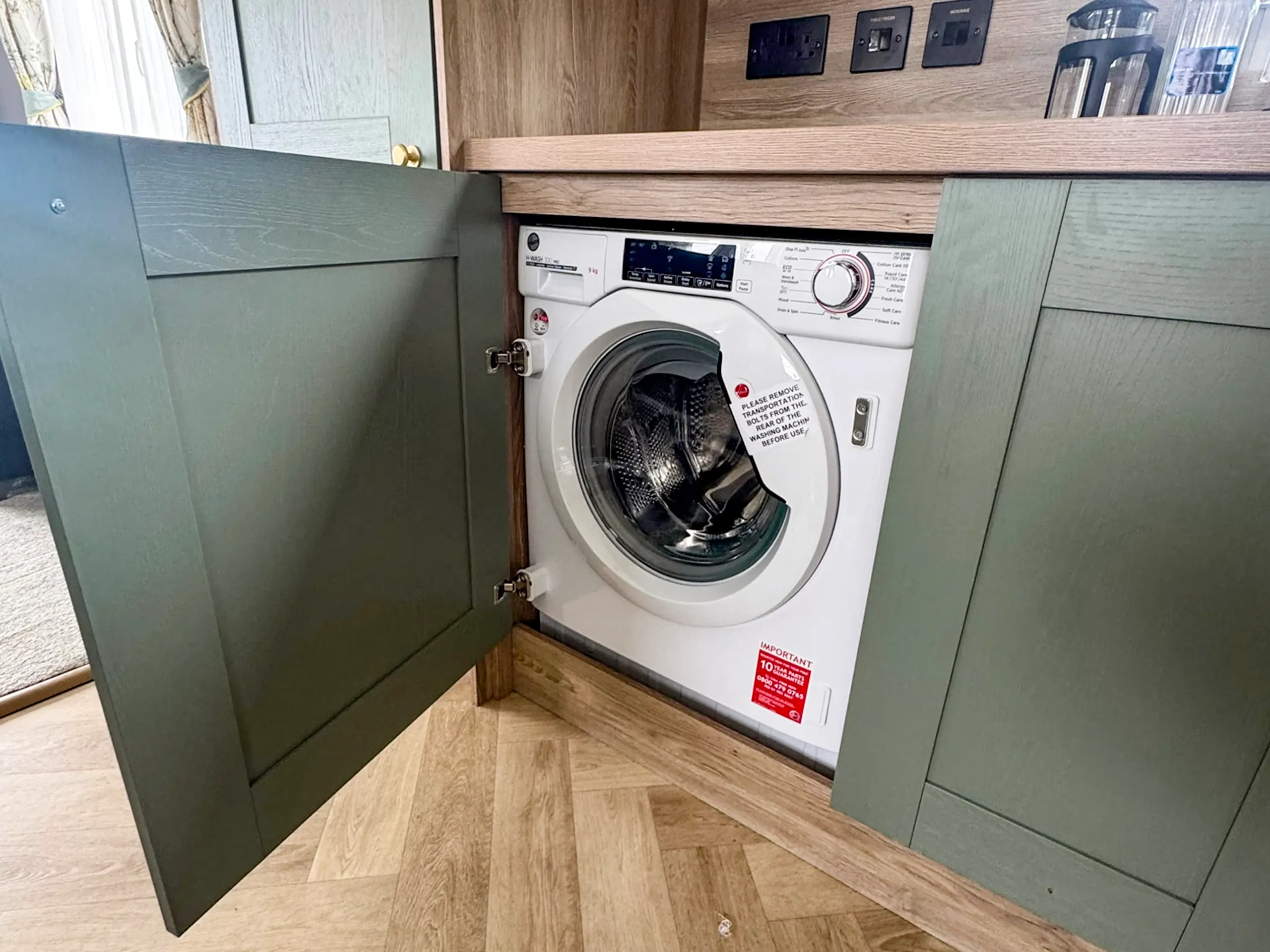 Modern kitchen with washer in the 2023 ABI Ingleton holiday home