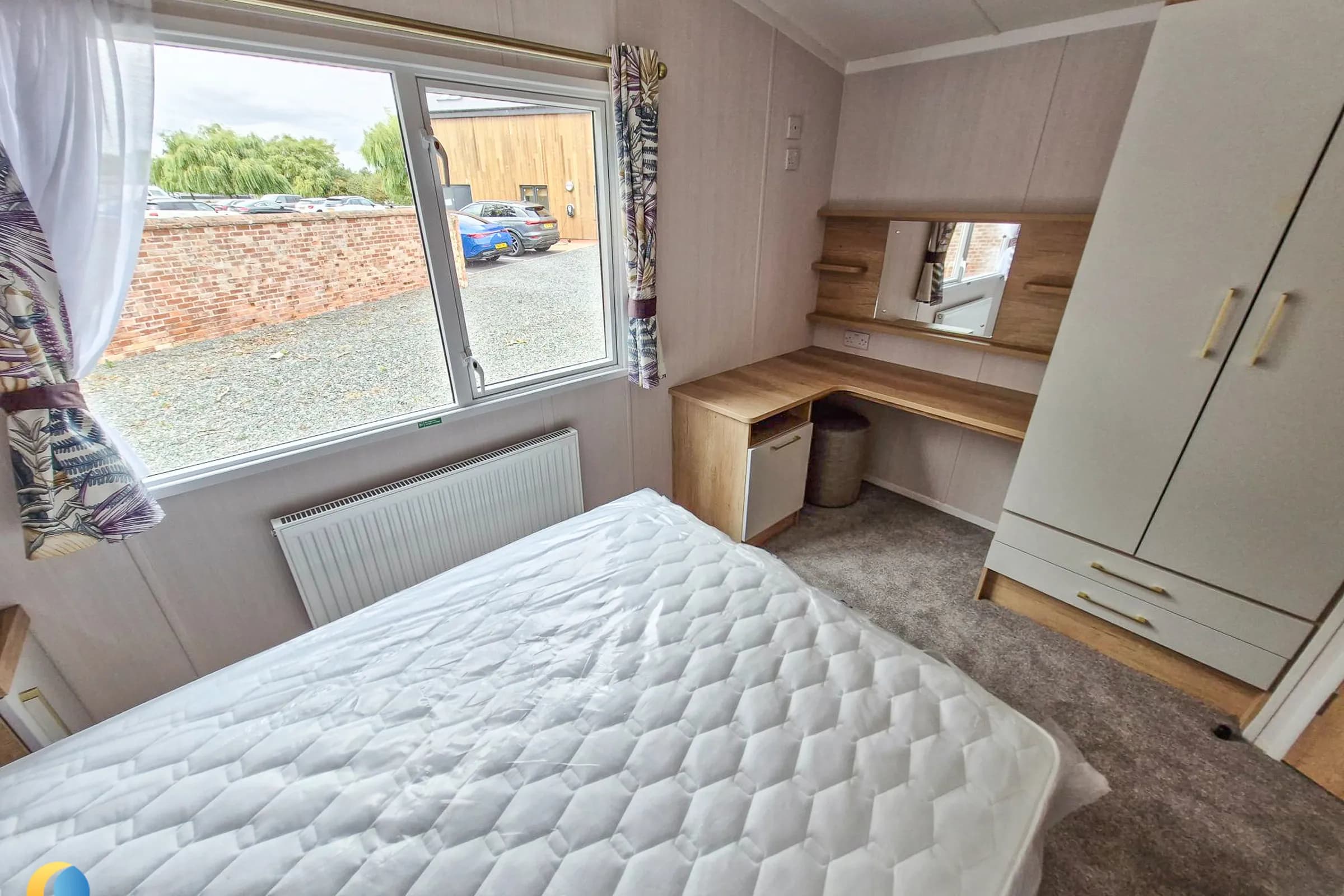Coastfields 2026 Swift Bordeaux main double bedroom with wardrobe and dressing area