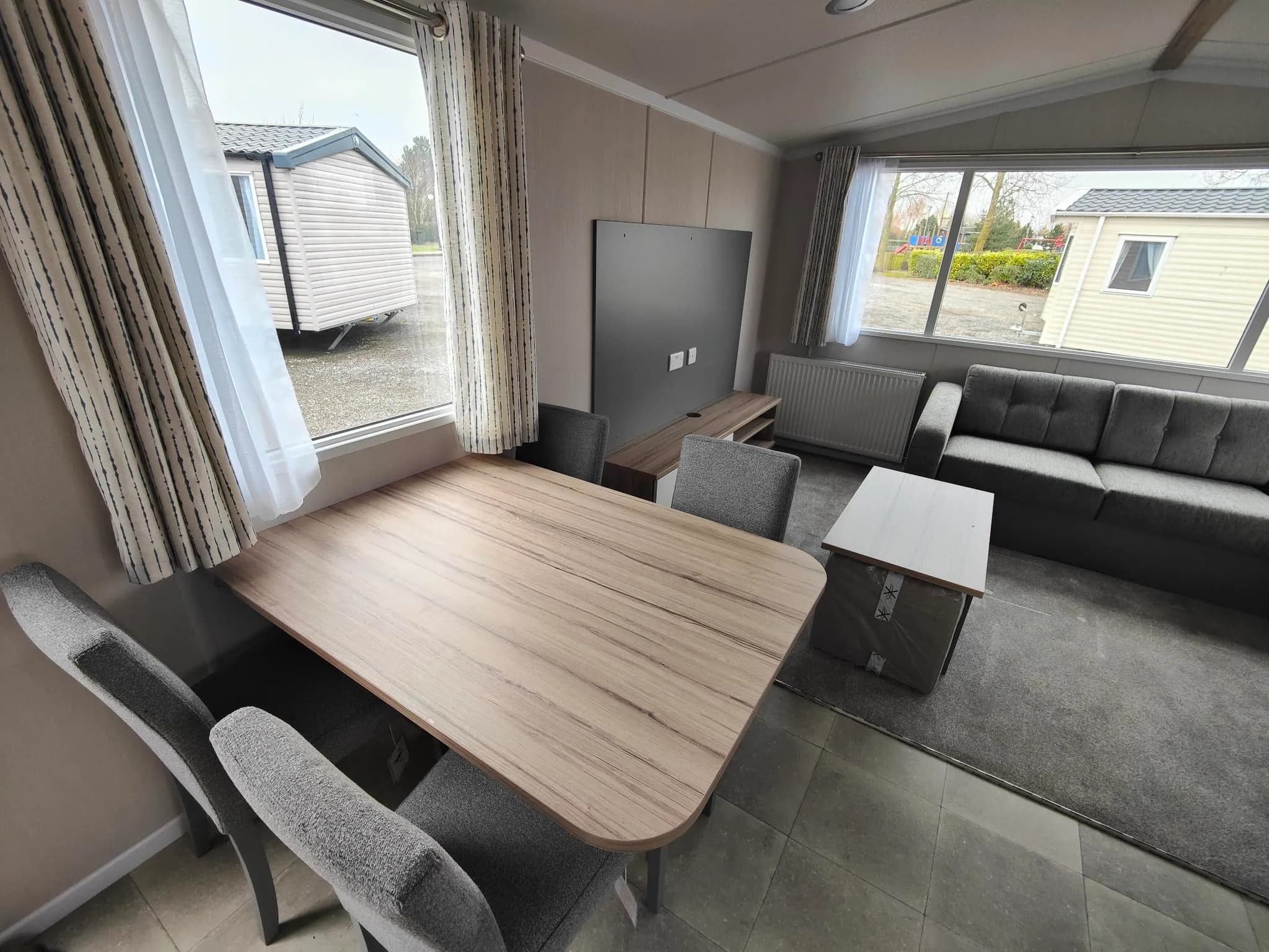 Spacious lounge and dining area in the 2024 Swift Royan holiday home