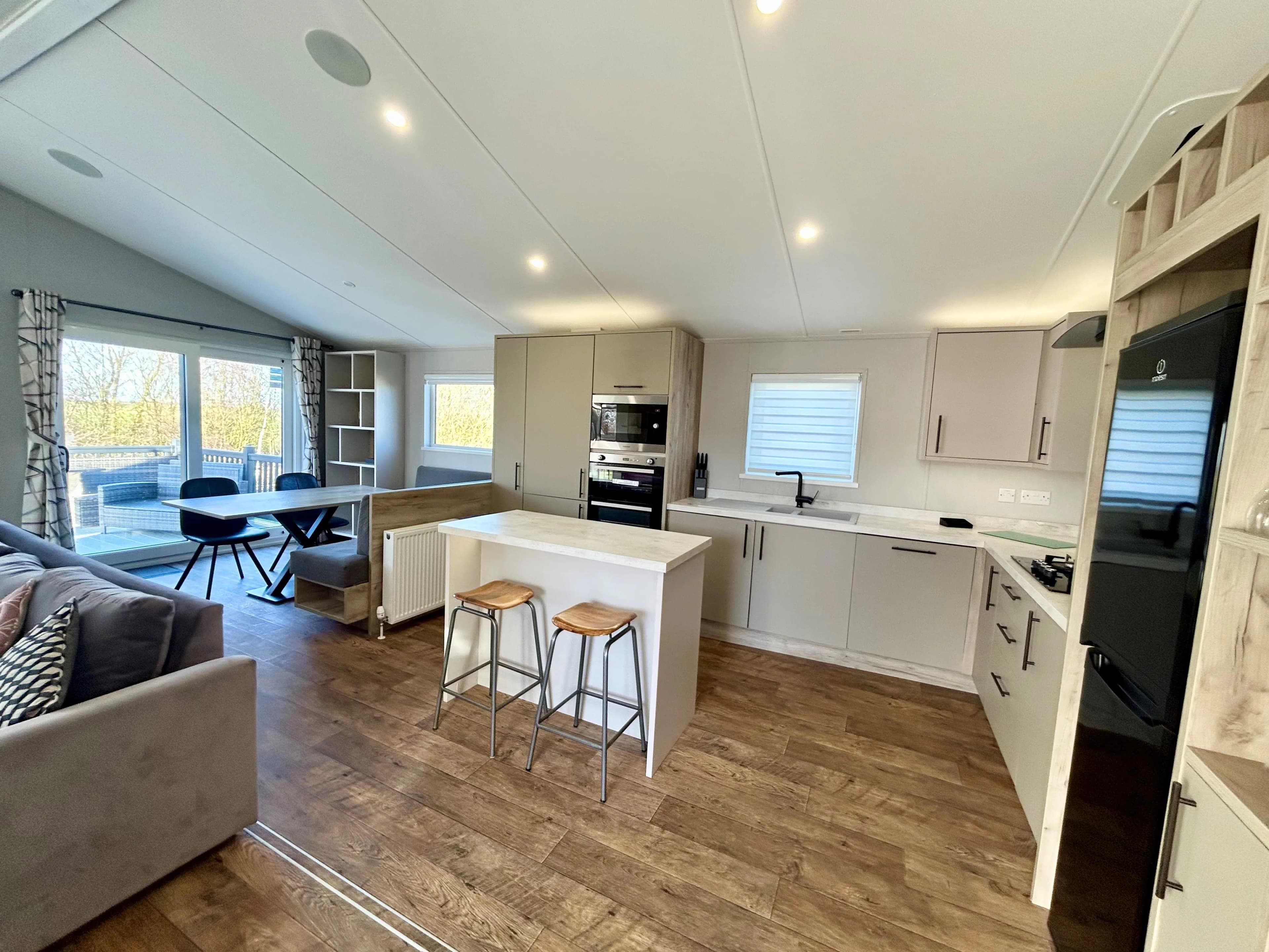 Modern kitchen with central island in the 2021 Willerby Mapleton lodge