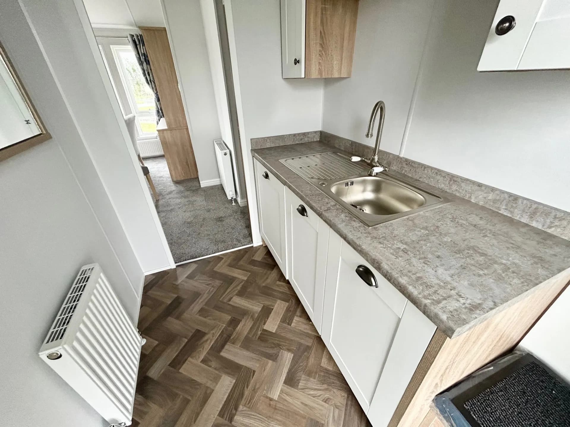 Side area of the Modern kitchen with central island in the 2026 Willerby Pinehurst Lodge