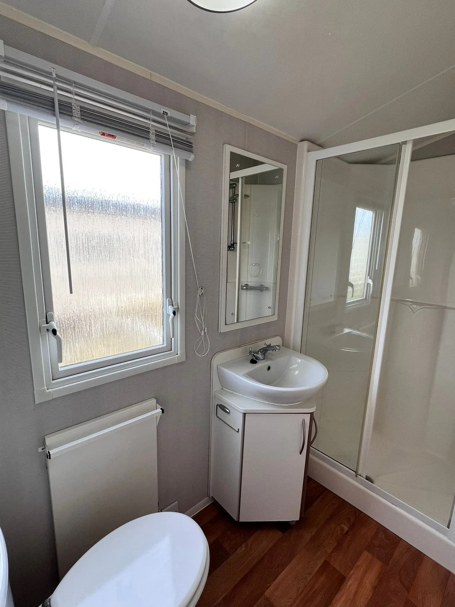 Family shower room with WC and wash basin in the 2012 Willerby Rio Gold