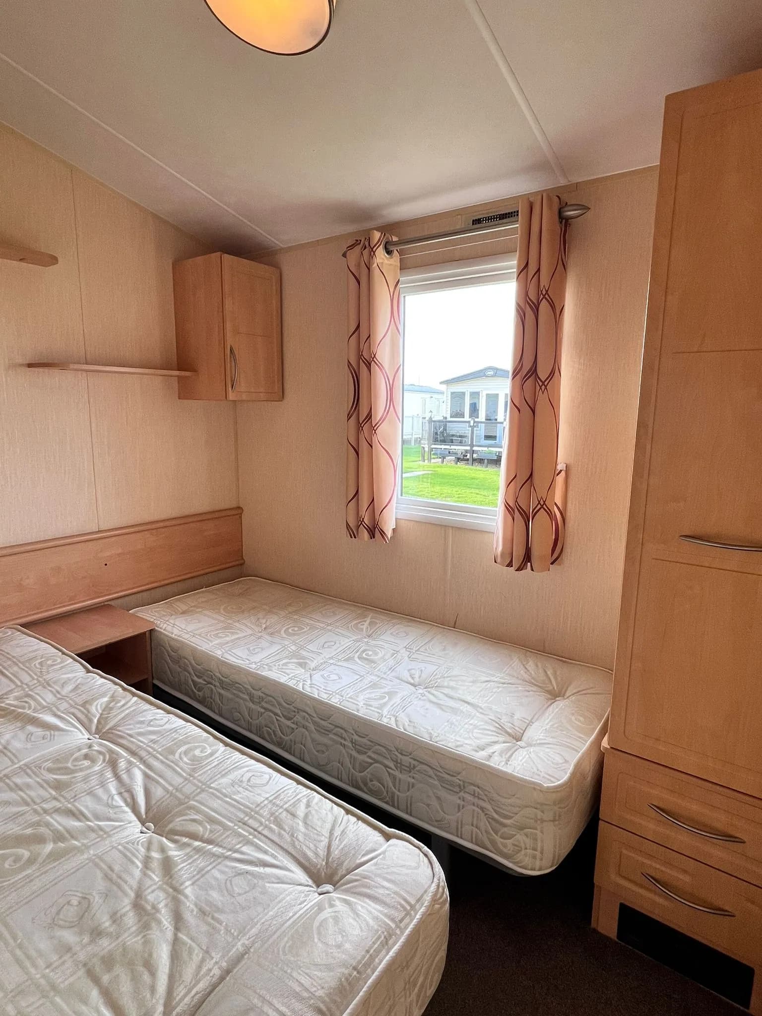 Twin bedroom with two single beds in the 2012 Willerby Rio Gold