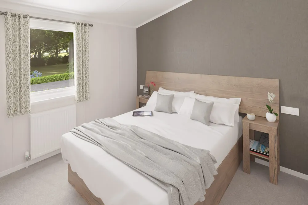 King-size master bedroom with walk-in dressing area in the 2025 Swift Montreal Lodge