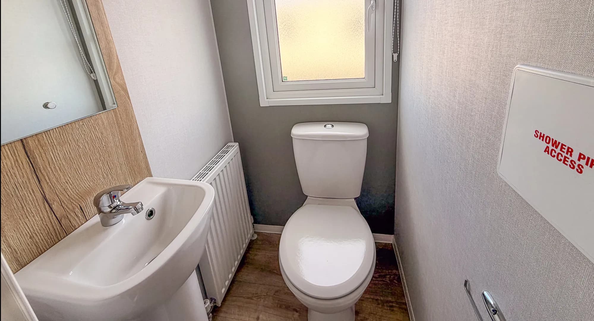 second bathroom with a toilet and sink