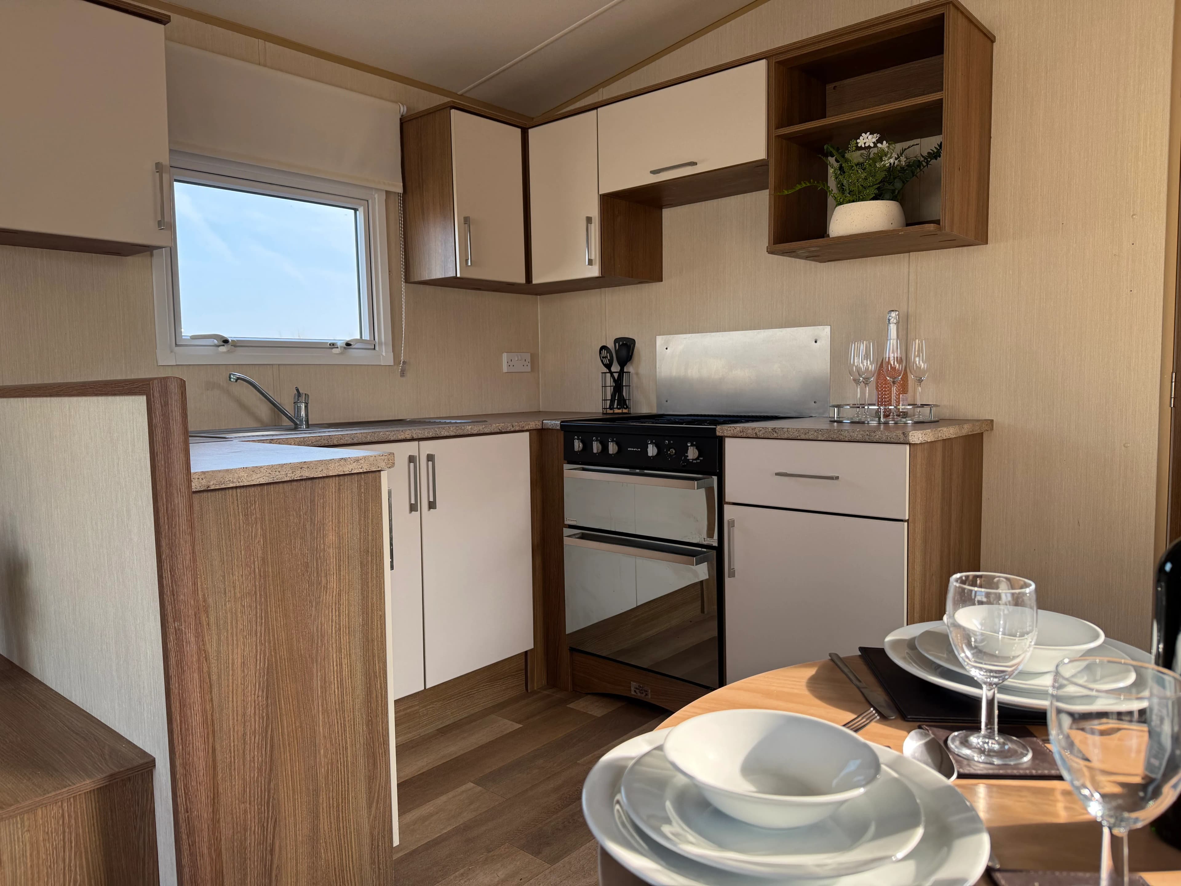 Modern kitchen in the 2015 ABI Summerbreeze with four-burner cooker and generous worktop space