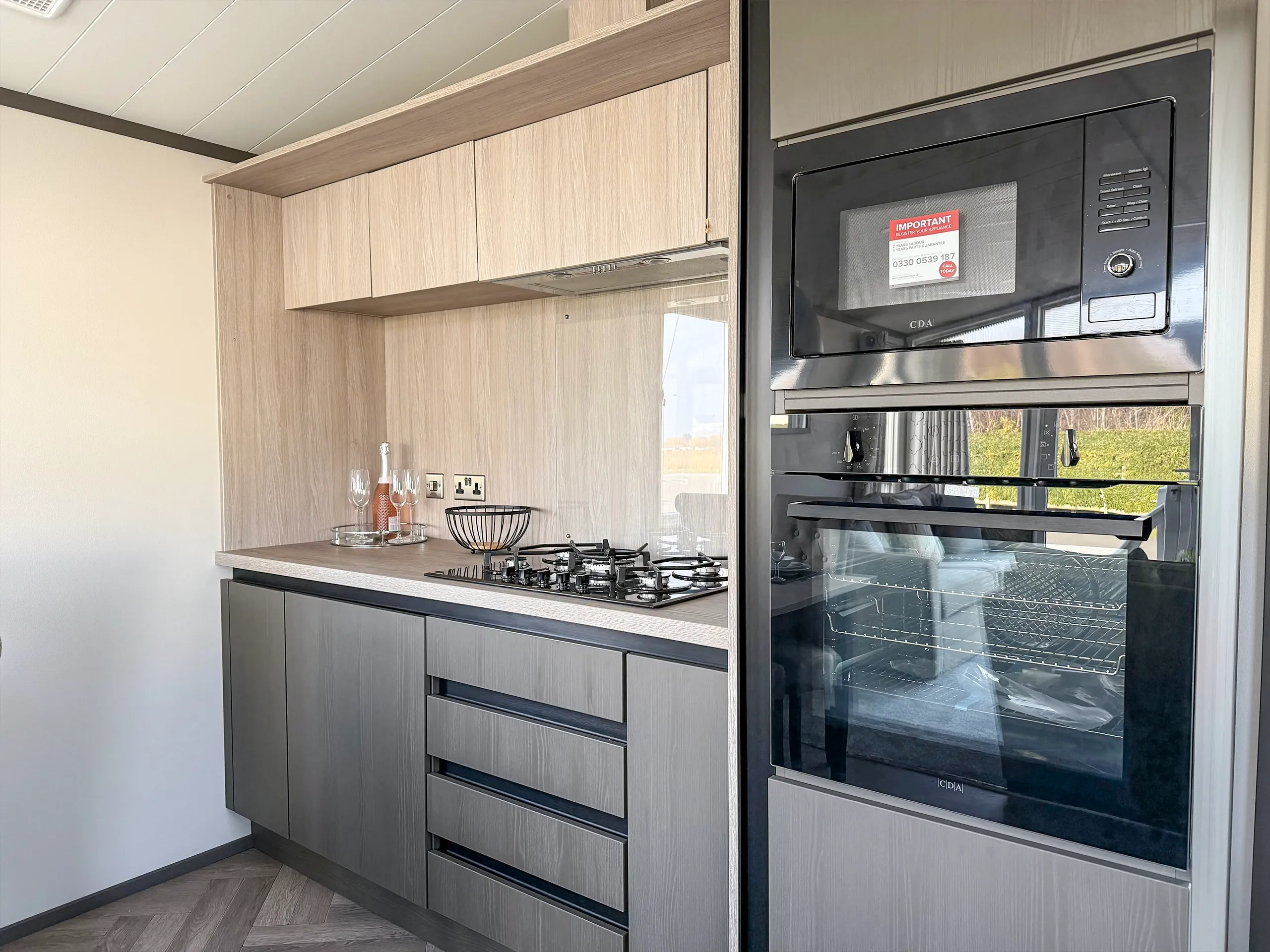 Modern fitted kitchen with integrated appliances in the 2023 Victory Lakewood Lodge