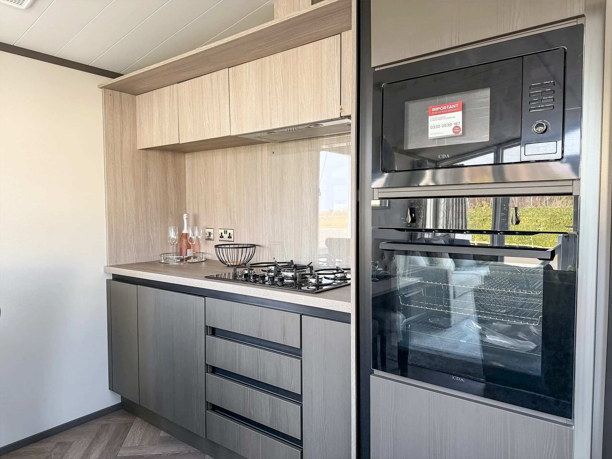 Modern fitted kitchen with integrated appliances in the 2023 Victory Lakewood Lodge