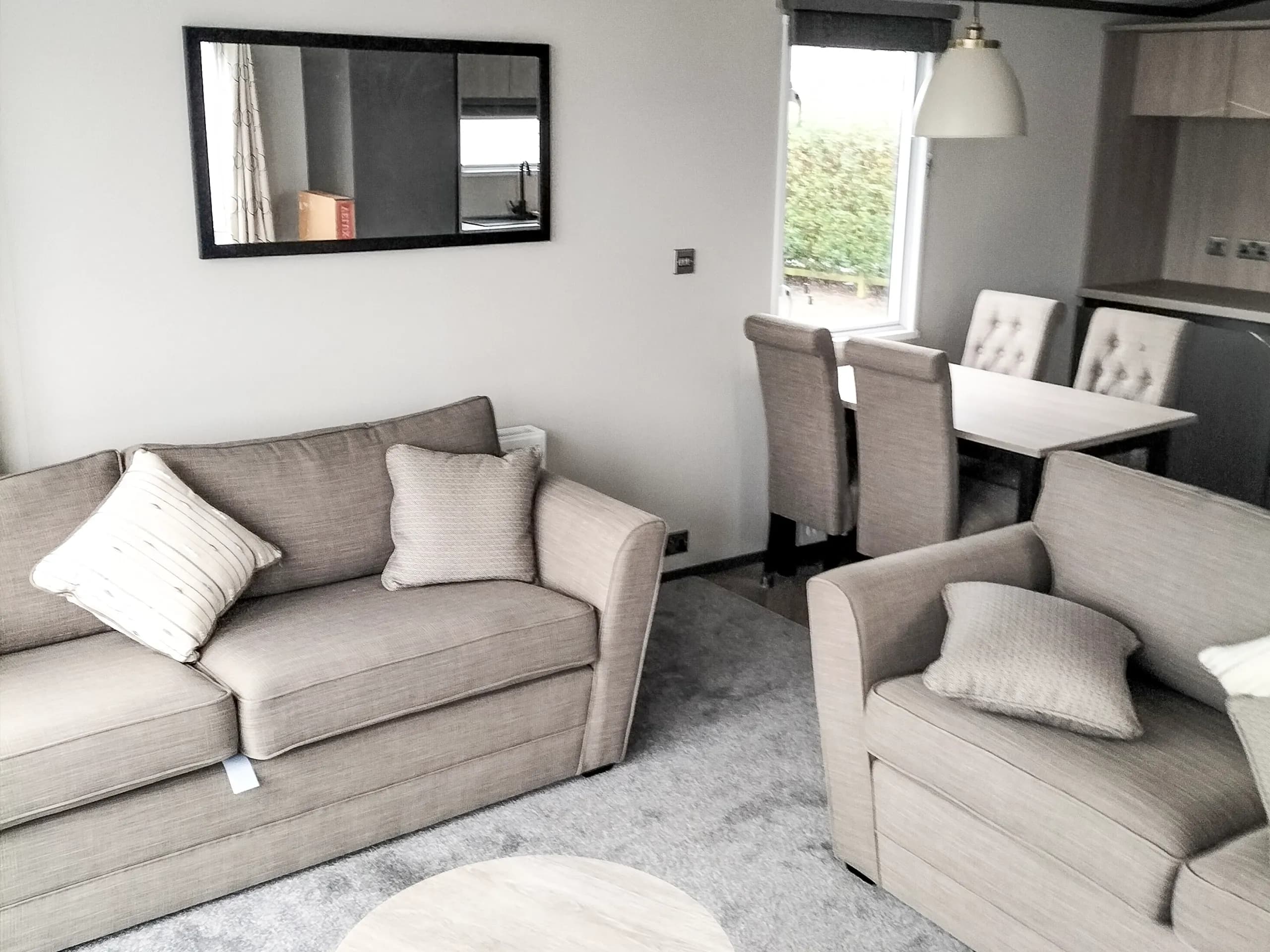 Bright and contemporary living area in the 2023 Victory Lakewood Lodge