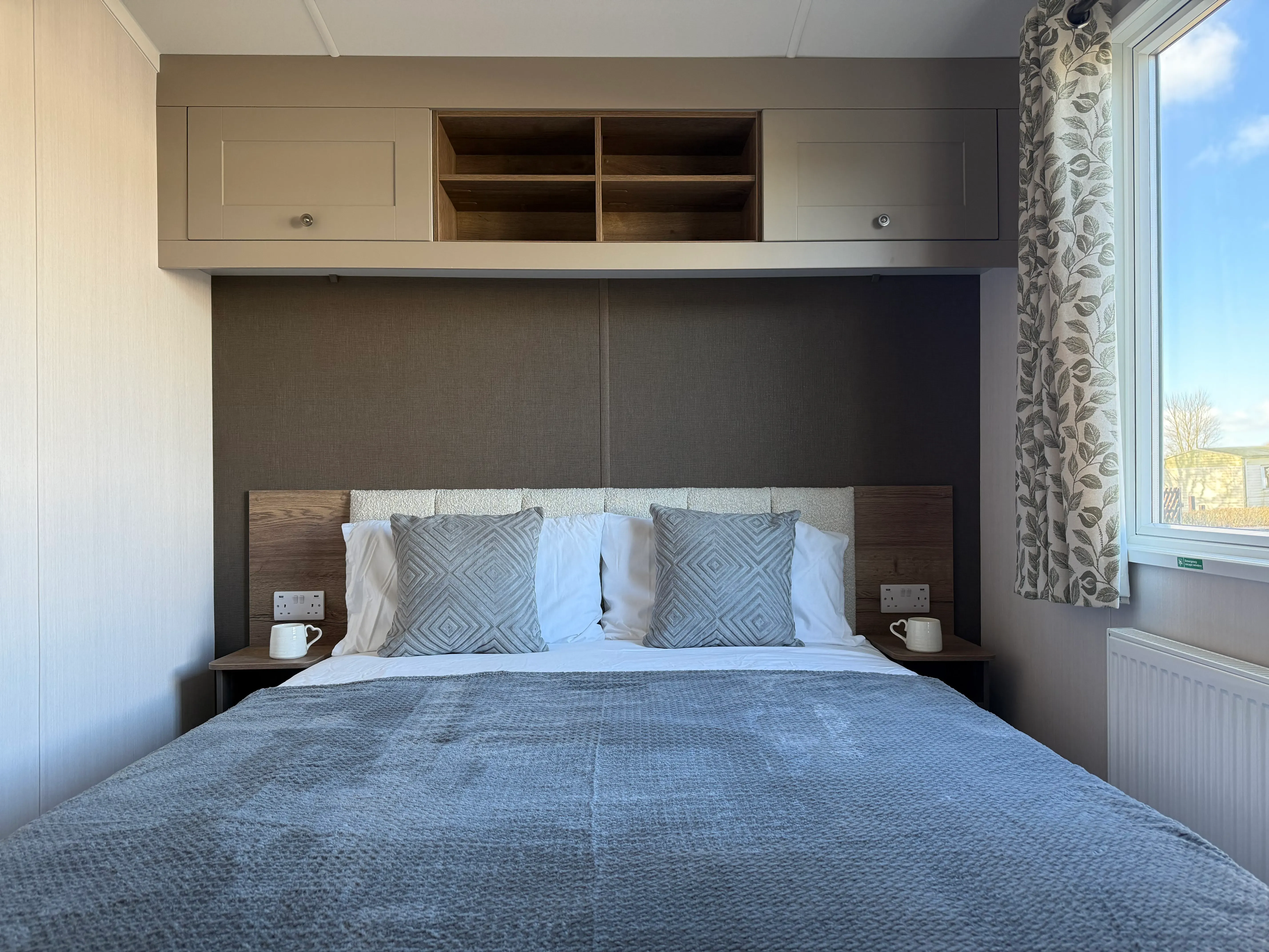 Master bedroom with Aurora Duvalay™ mattress and en-suite bathroom in the Swift Sienna.