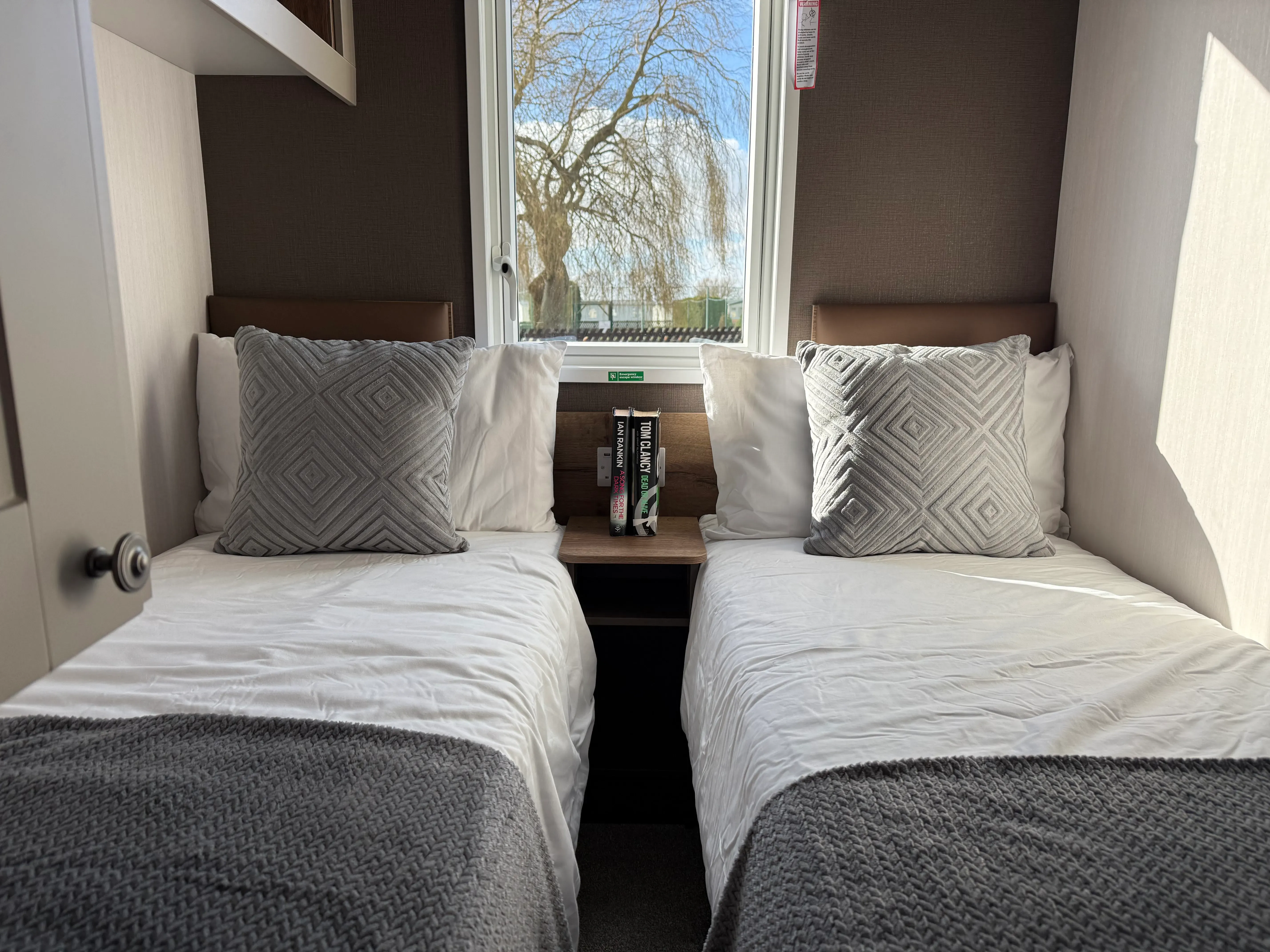 Secondary comfortable twin bedroom providing flexible family accommodation.