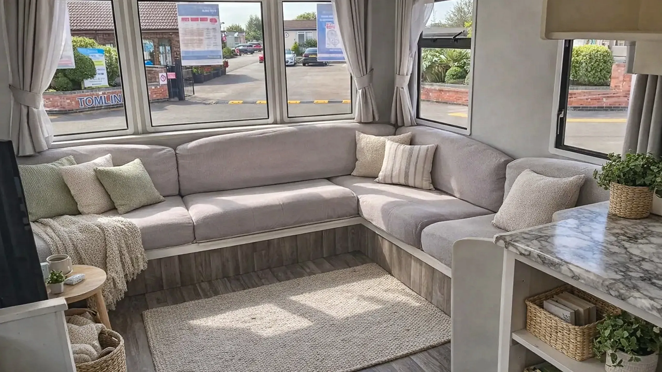 Living room of the 2003 ABI Arizona with comfortable seating and pull-out sofa bed