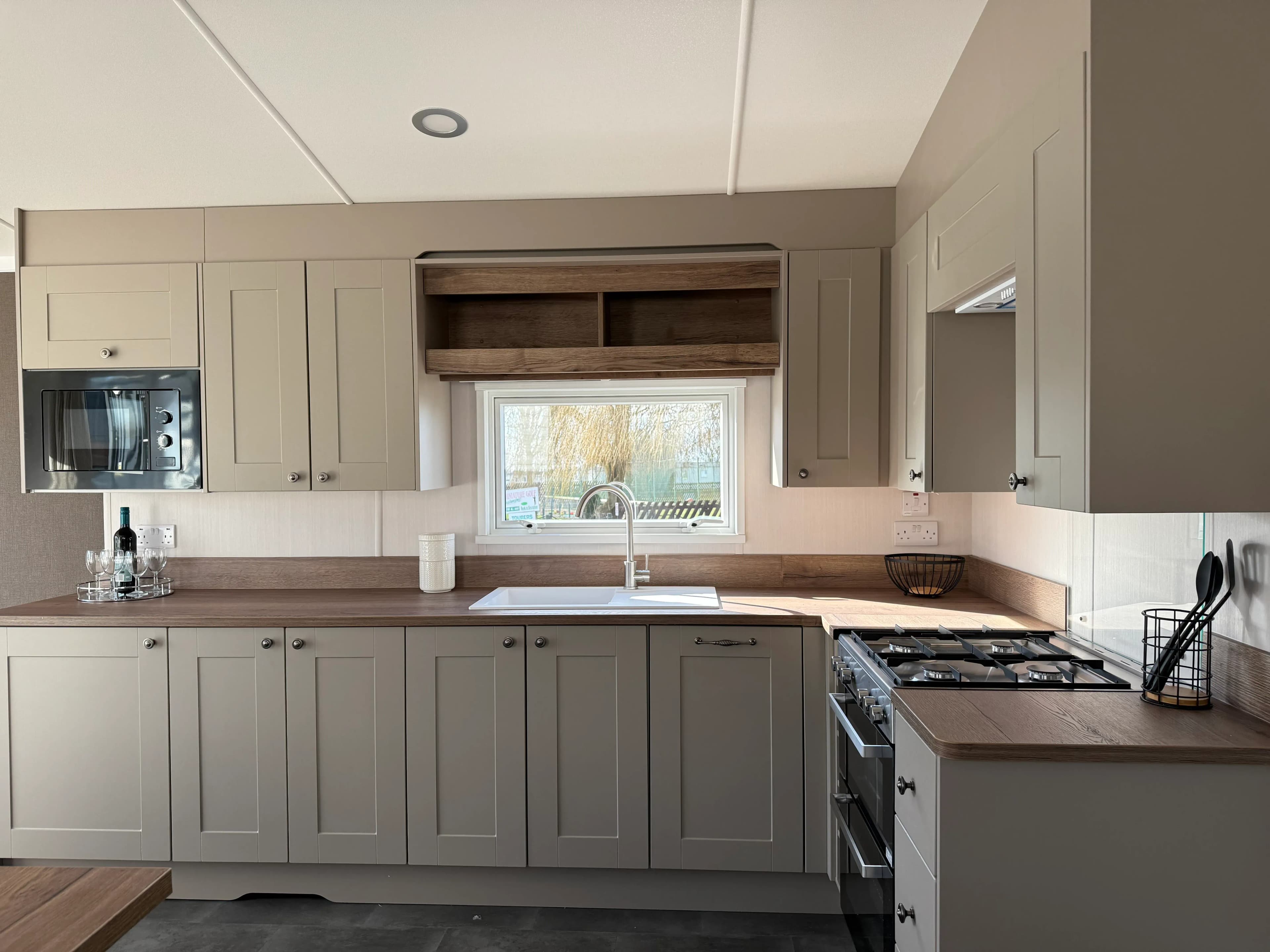 Contemporary kitchen in the 2026 Swift Morlaix with integrated appliances and generous worktop space
