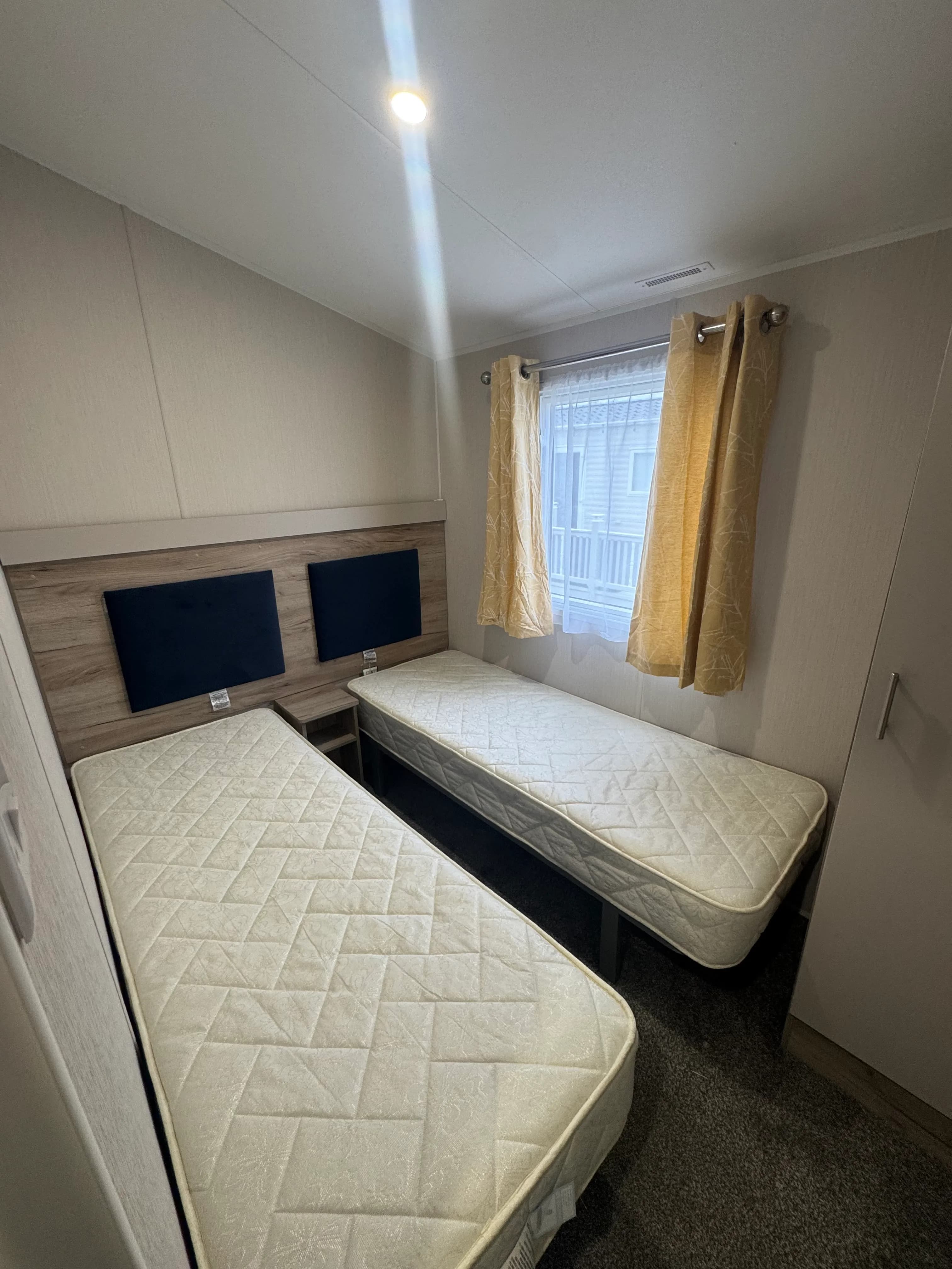 Willerby Linwood bedroom with two single beds, and a window
