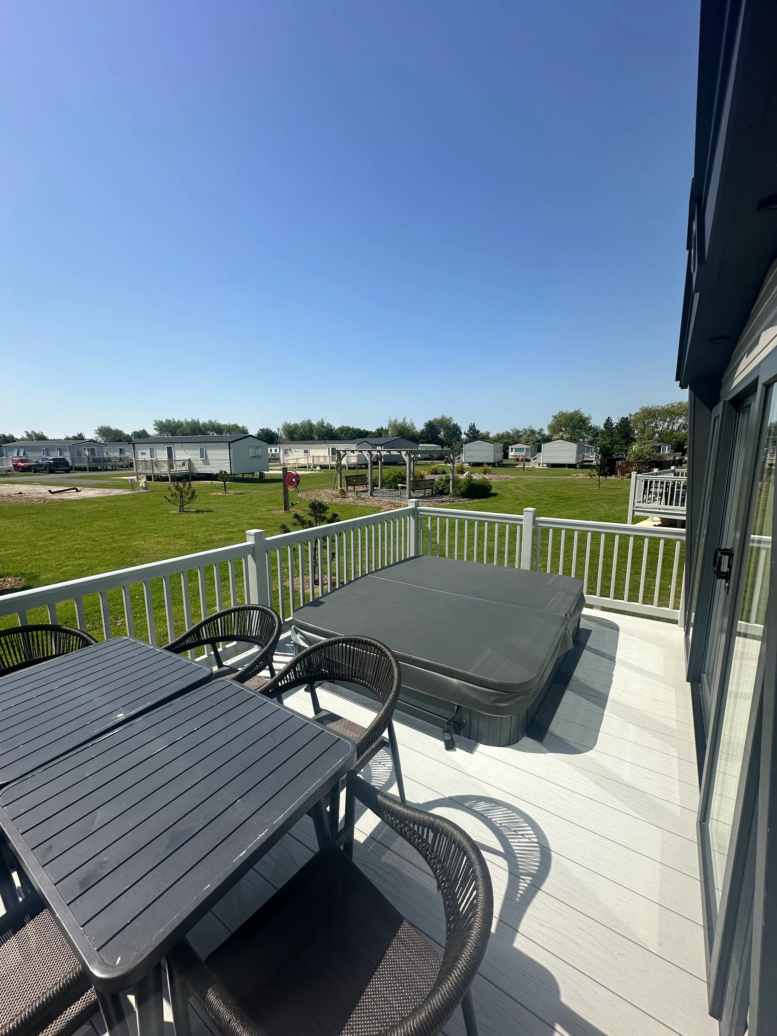 Private hot tub on the decking of the 2026 ABI Louis holiday home
