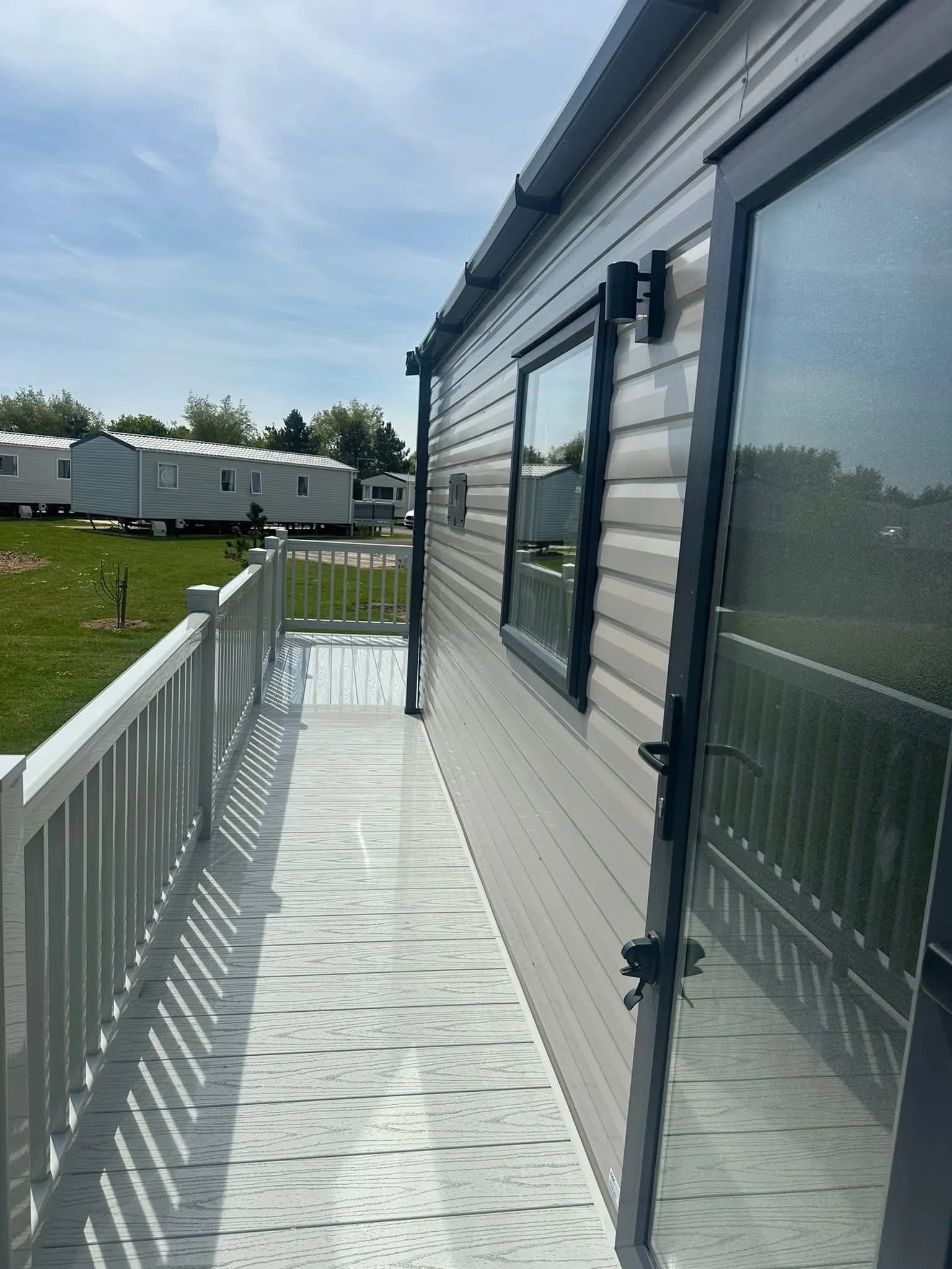 Spacious decking outside the 2026 ABI Louis holiday home at Grange Leisure Park