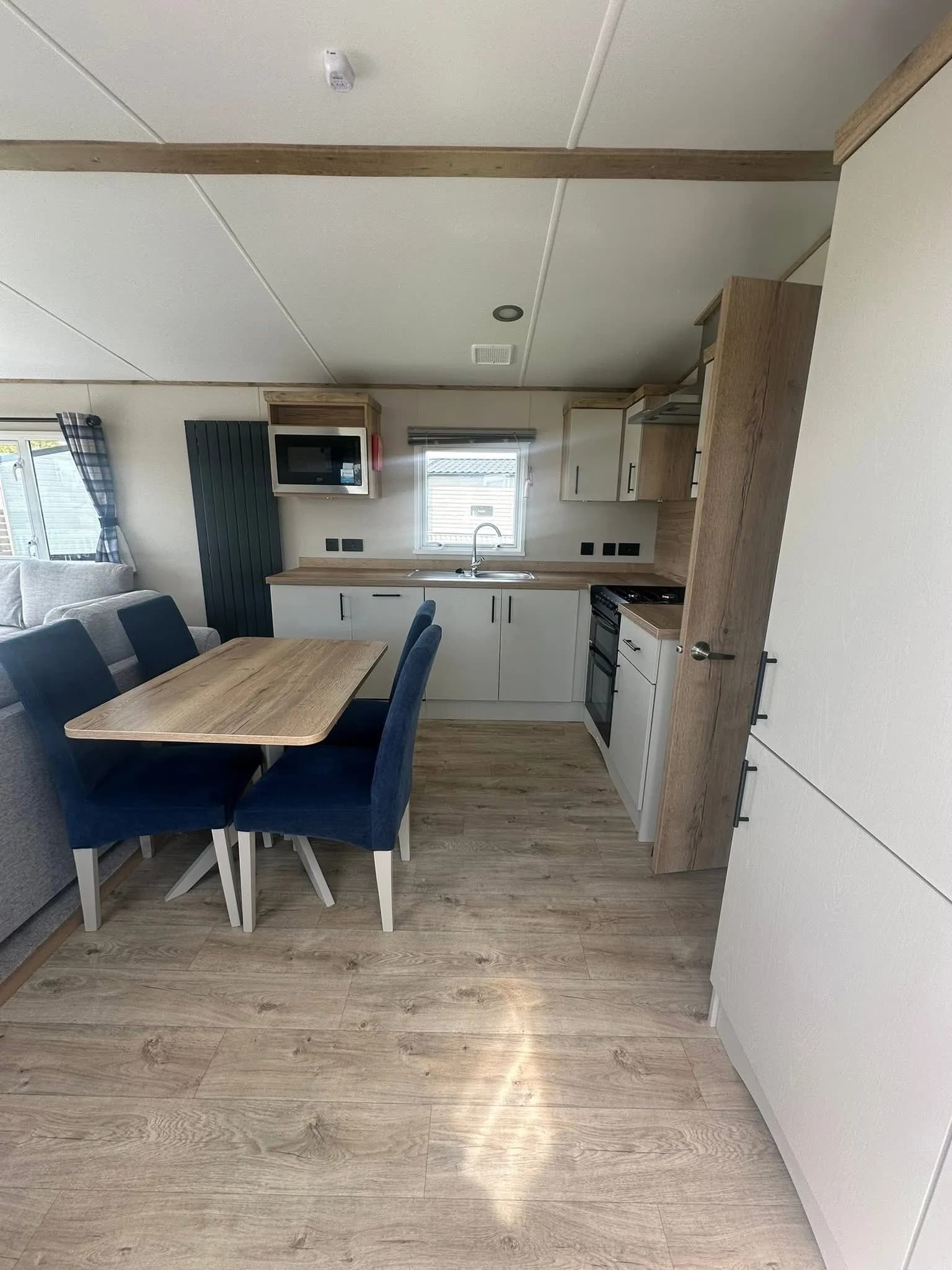 Open-plan living and dining area in the 2026 ABI Louis