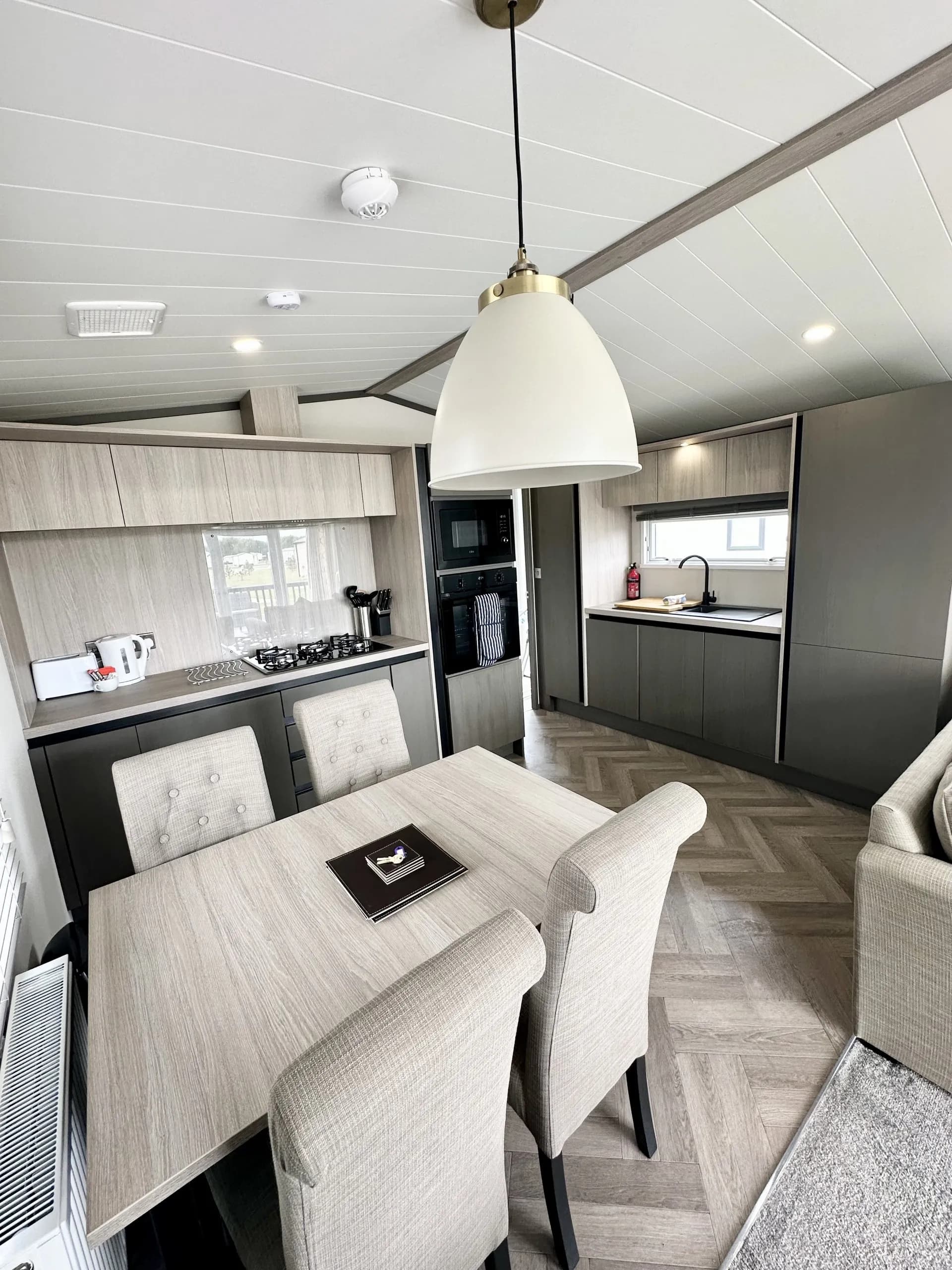 Modern kitchen with integrated appliances in the 2023 Victory Lakewood Lodge