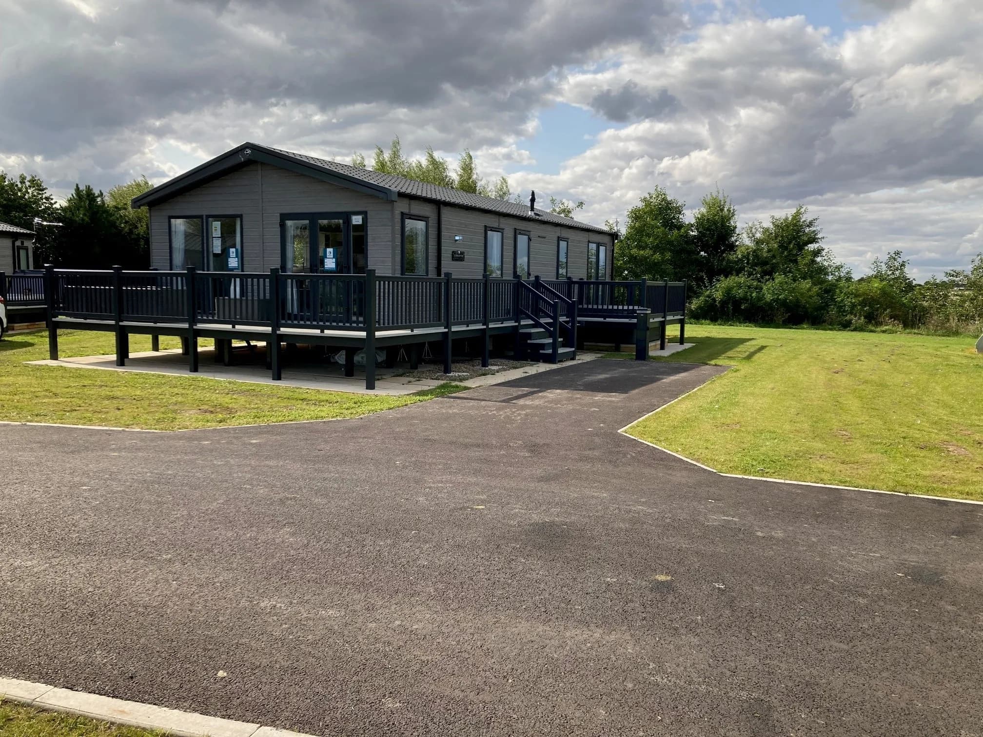 Large decking with private hot tub at the 2023 Swift Edmonton lodge